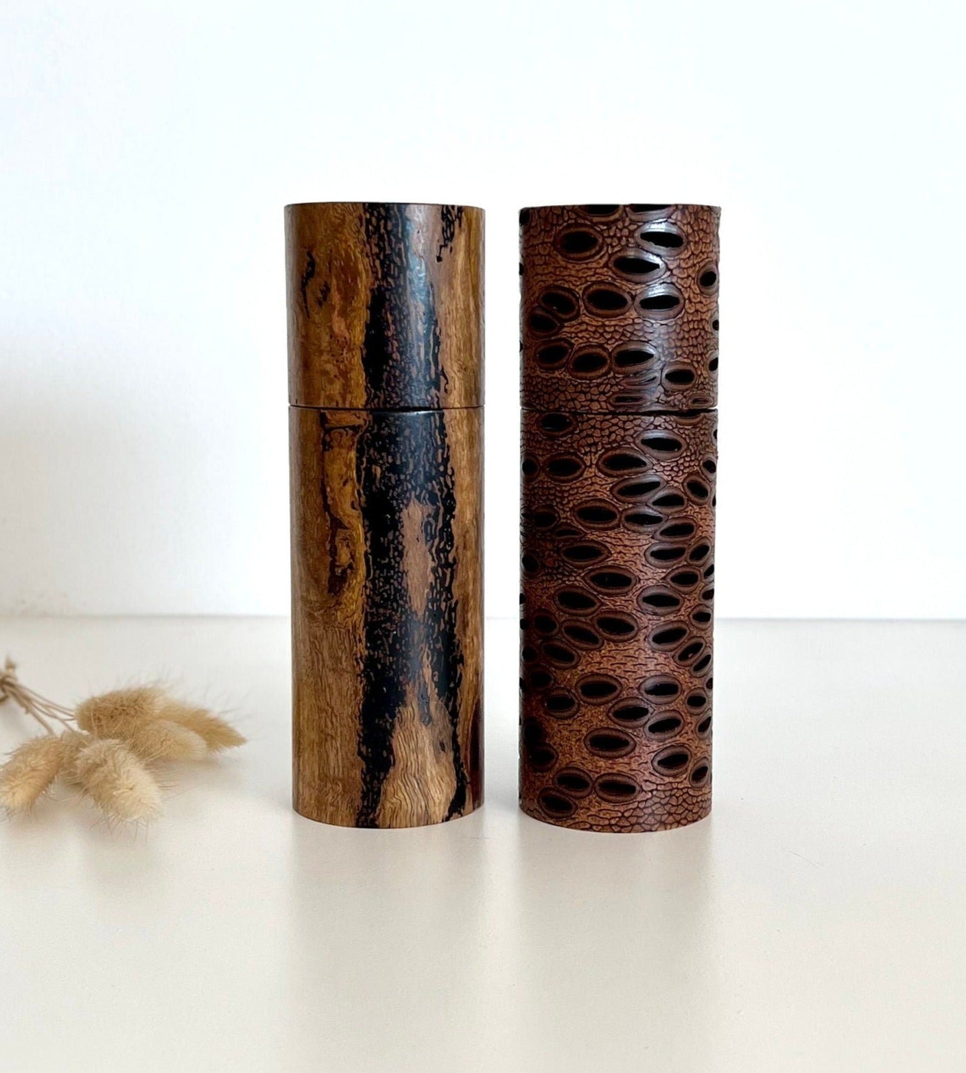 Wooden cylindrical shape salt and pepper grinders made from Australian Banksia seed pod and Marri timber