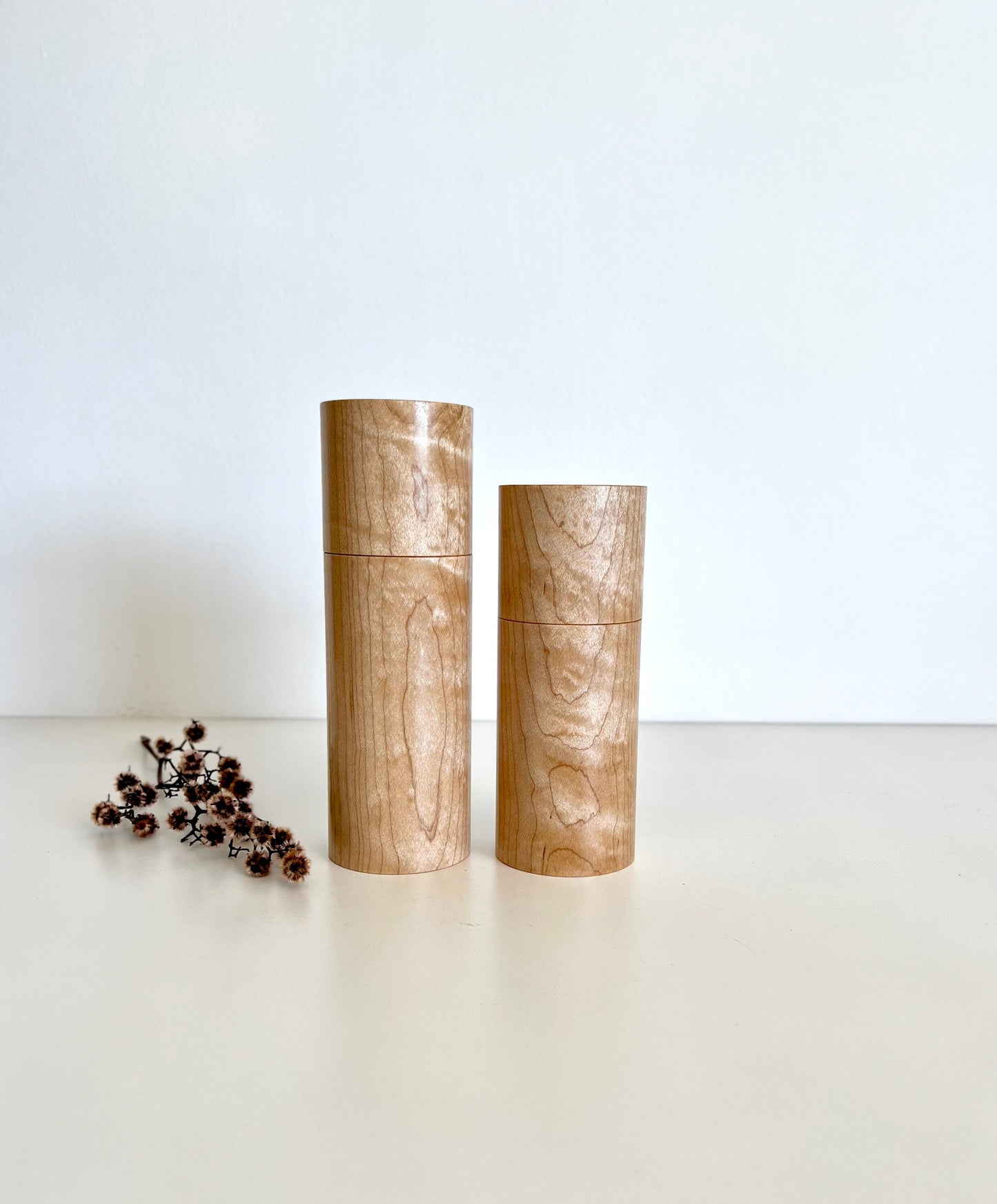 Wooden cylindrical shape salt and pepper grinders made from Maple timber