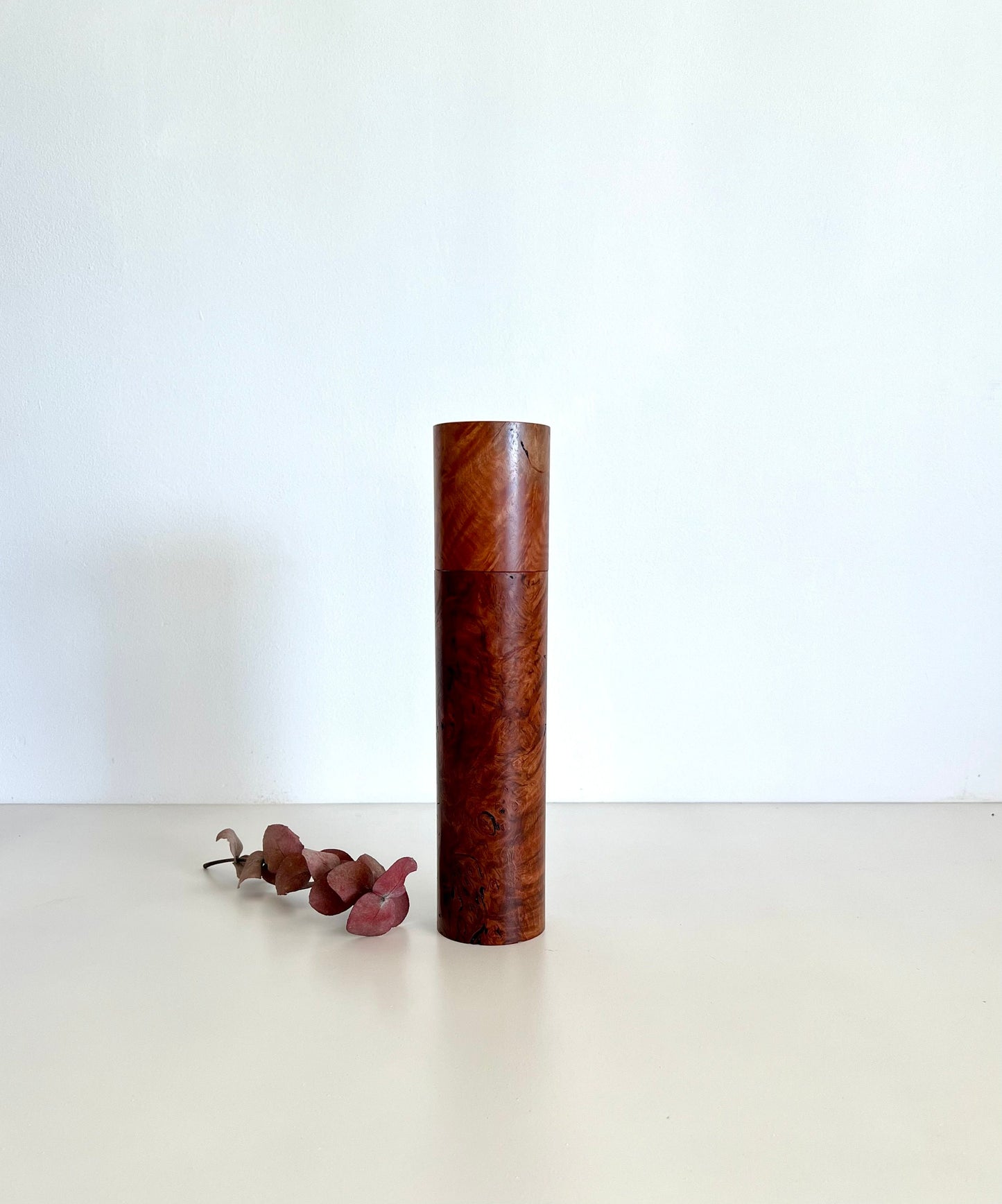 Wooden cylindrical shape salt and pepper grinder made from Australian Red Tingle burl timber