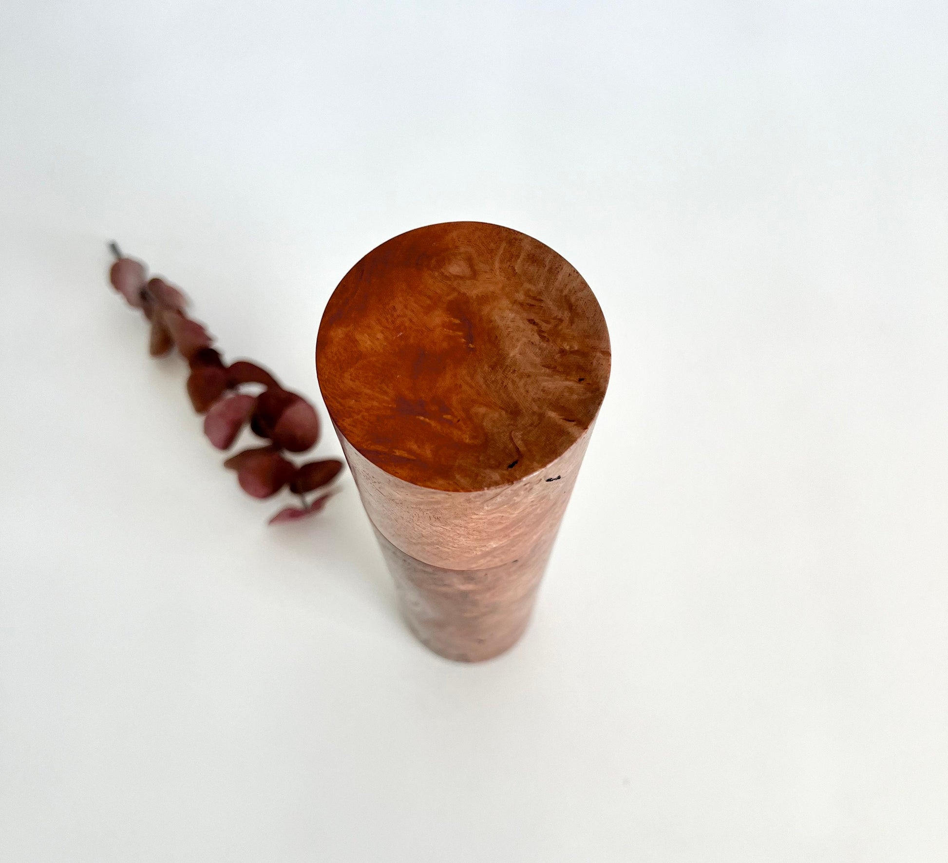 Birdseye view of wooden cylindrical shape salt and pepper grinder