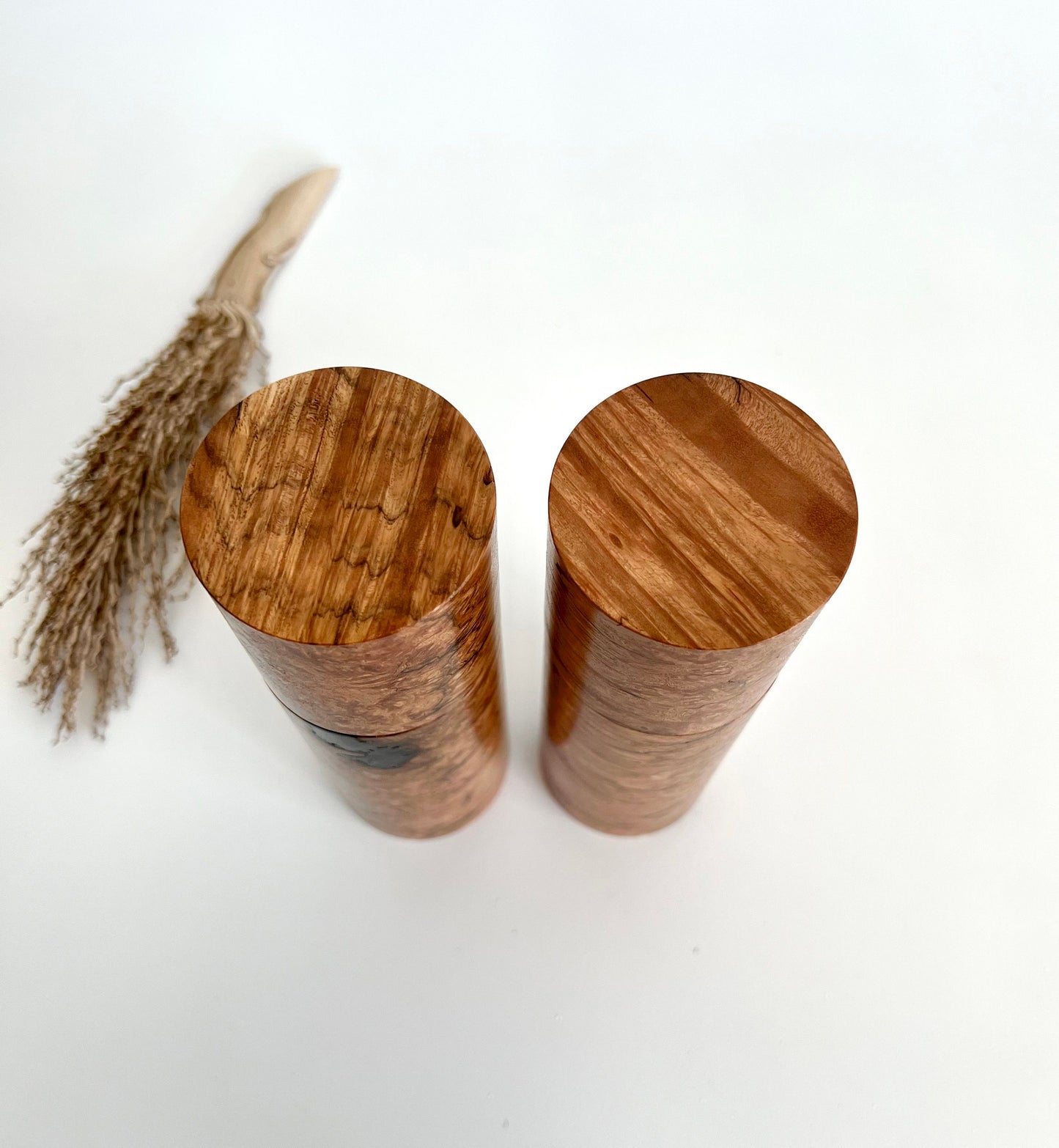 Birdseye view of wooden cylindrical shape salt and pepper grinders made from Australian Sugar gum timber.