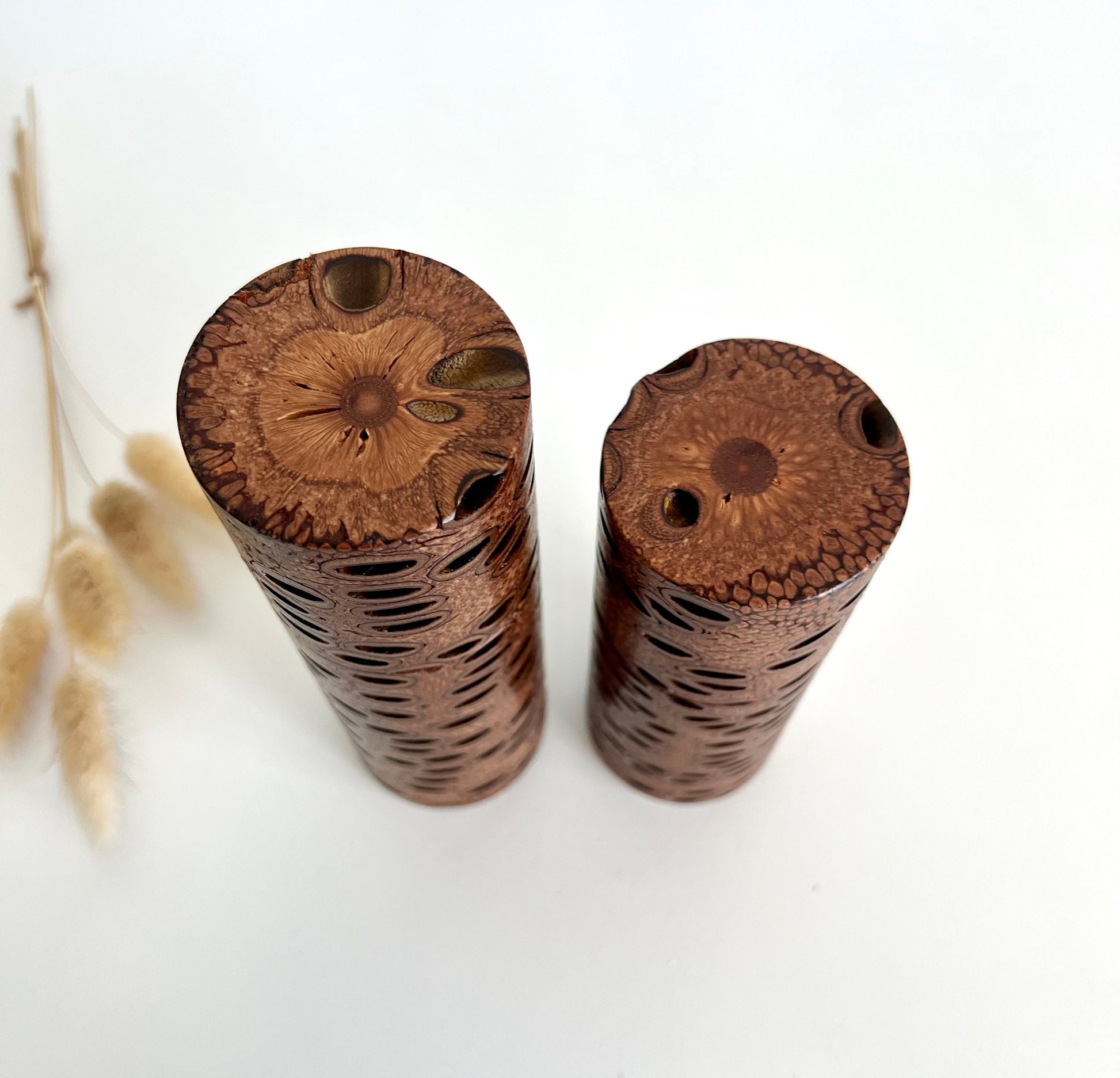 Birdseye view of wooden cylindrical shape salt and pepper grinder