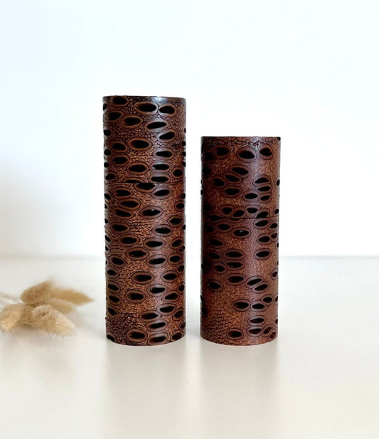 Wooden cylindrical shape salt and pepper grinders made from Australian Banksia seed pod timber