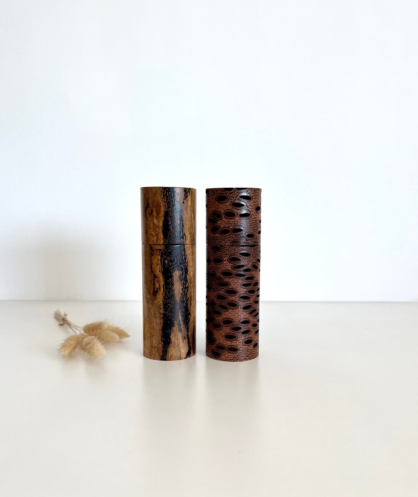 Wooden cylindrical shape salt and pepper grinders made from Australian Banksia seed pod and Marri timber