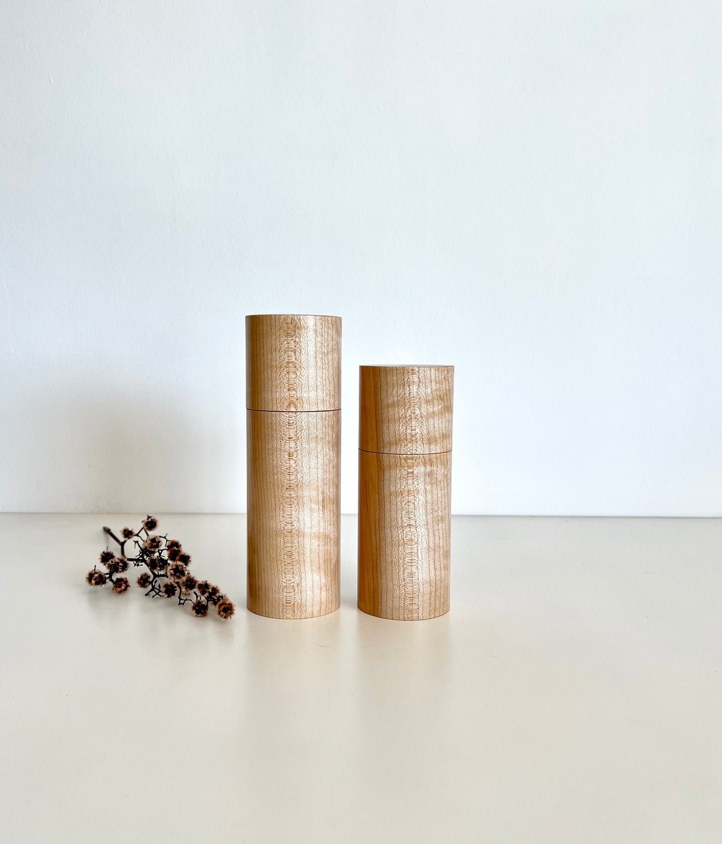 Wooden cylindrical shape salt and pepper grinders made from Maple timber