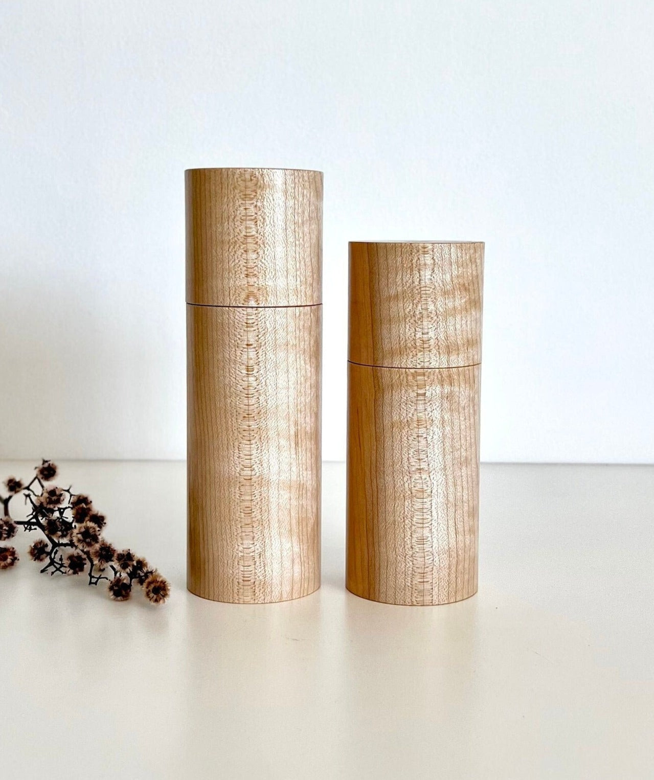 Wooden cylindrical shape salt and pepper grinders made from Maple timber