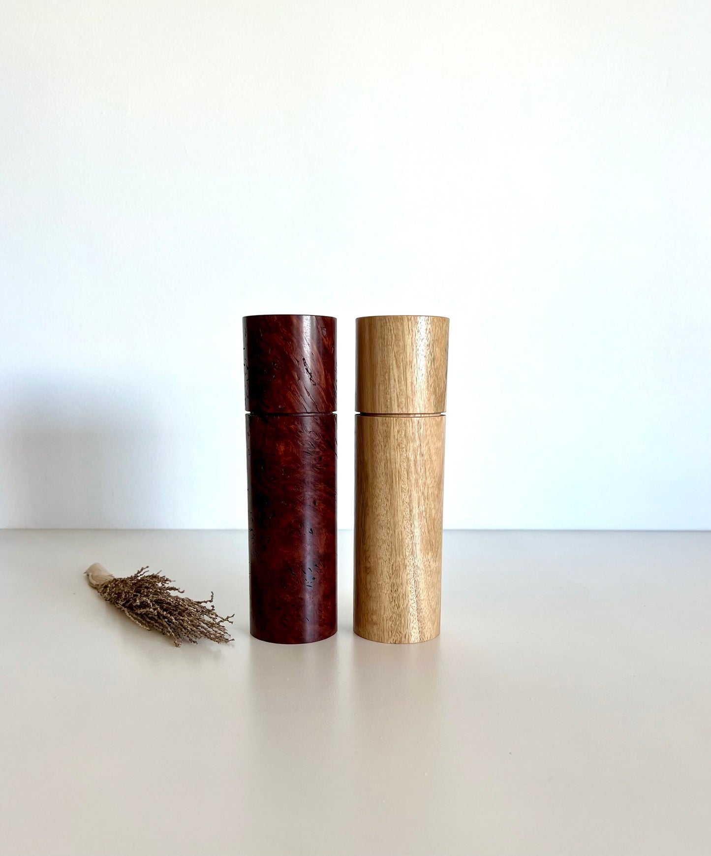 Wooden cylindrical shape salt and pepper grinders made from Australian Jarrah burl and Blackbutt timbers