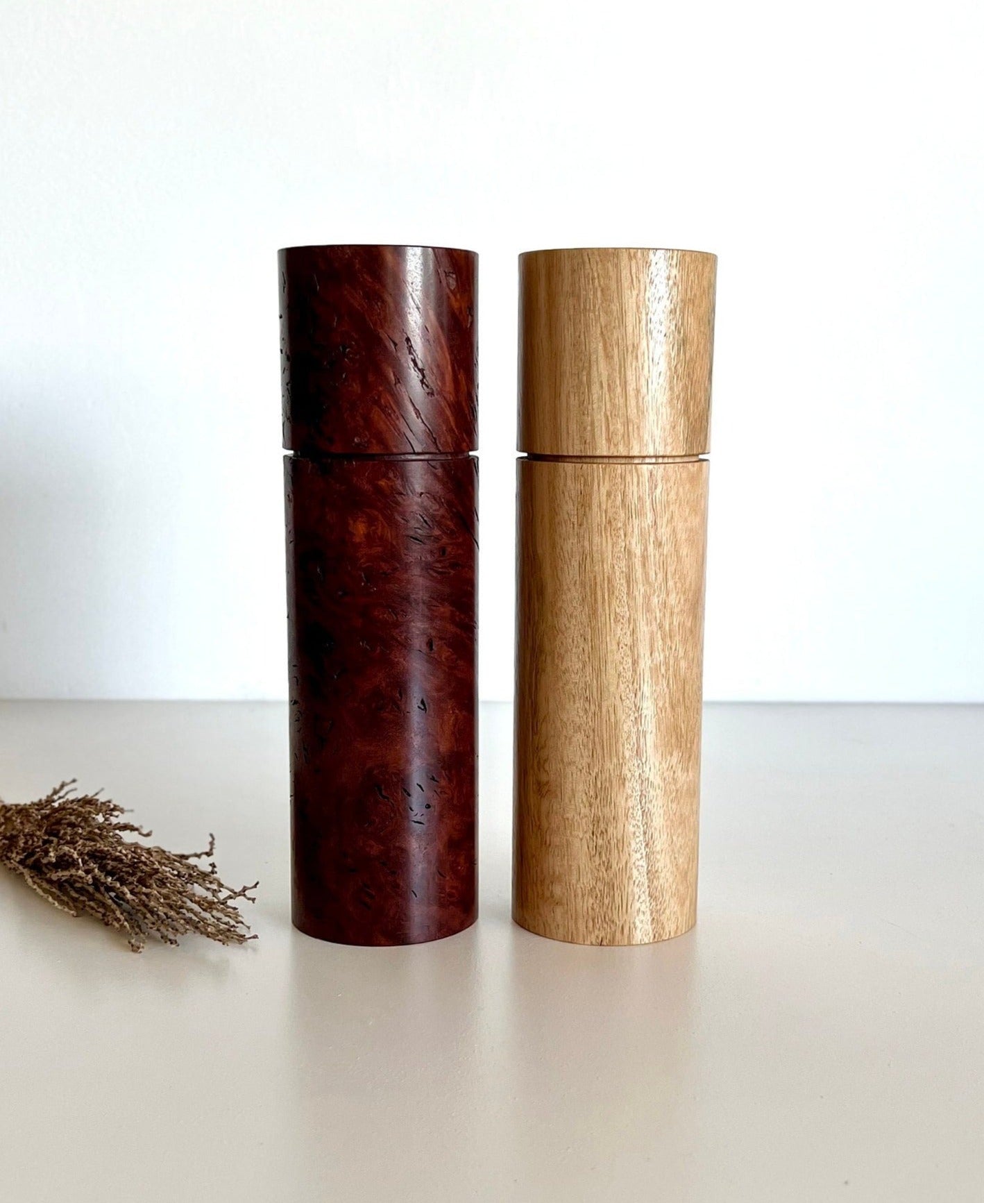 Wooden cylindrical shape salt and pepper grinders made from Australian Jarrah burl and Blackbutt timbers