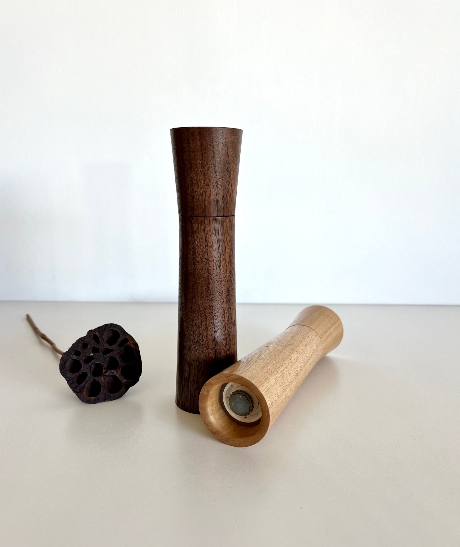 Bottom of salt and pepper grinder showing Crushgrind ceramic grinding mechanism and the adjustment knob