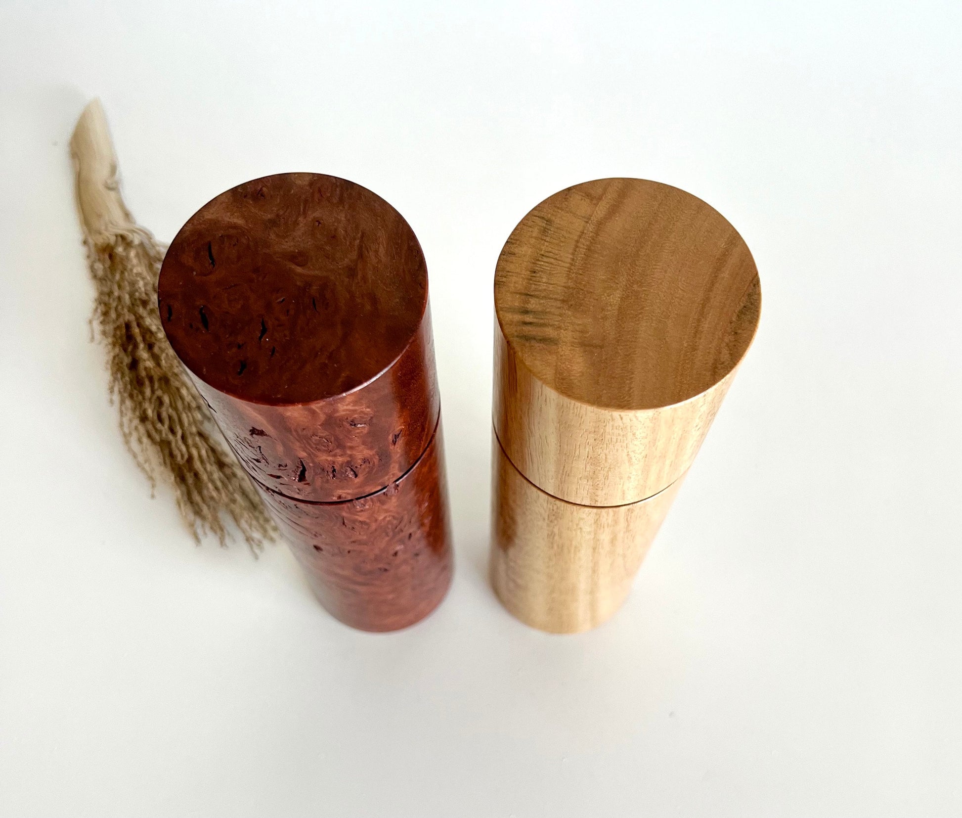 Birdseye view of wooden cylindrical shape salt and pepper grinders made from Australian Jarrah burl and blackbutt timbers