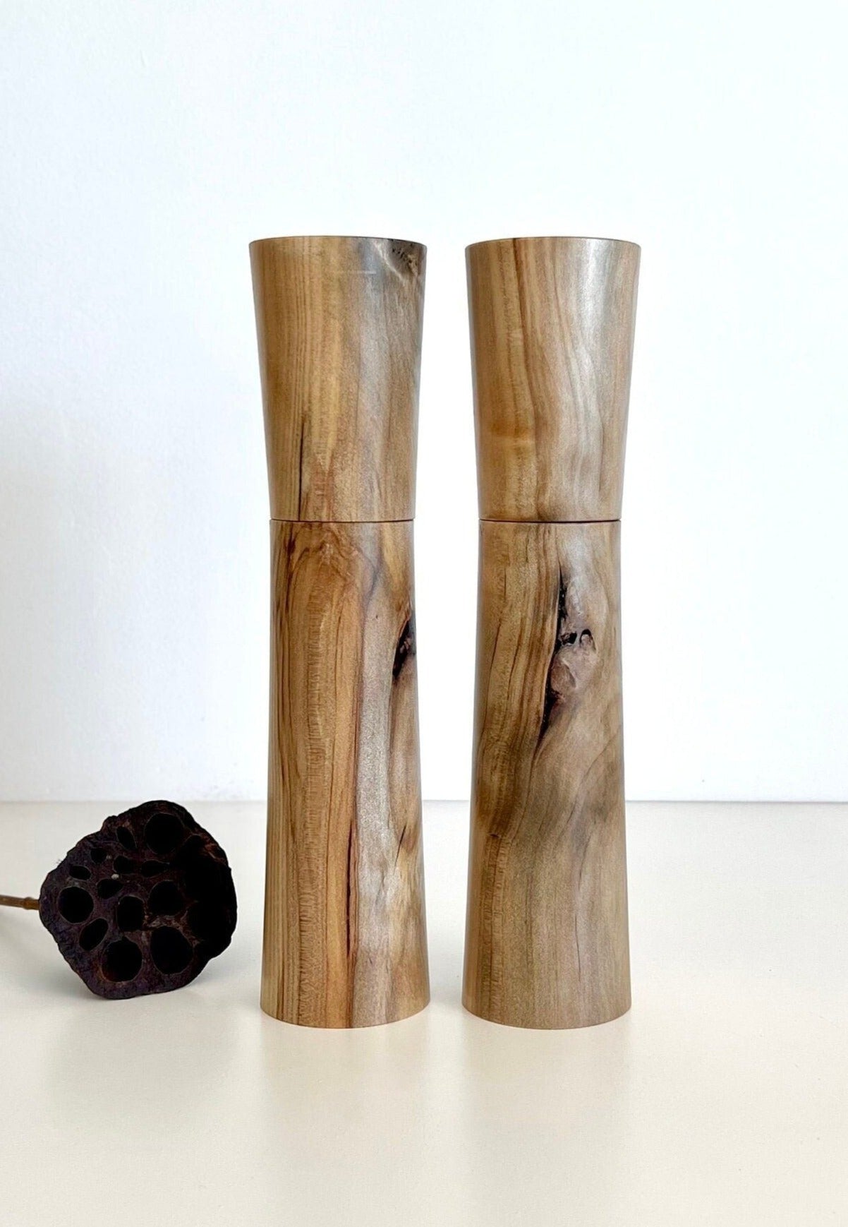 Wooden cylindrical shape salt and pepper grinders made from Australian Norfolk Island Pine timber