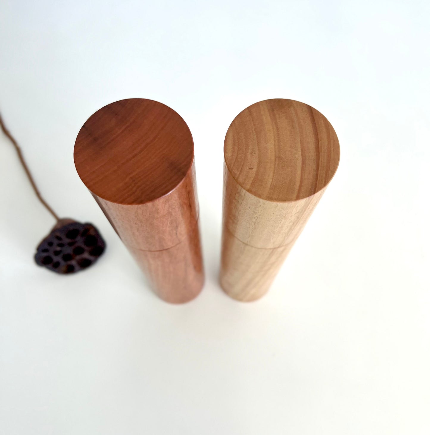 Birdseye view of wooden cylindrical shape salt and pepper grinders made from Australian Wandoo and Blackbutt timbers.