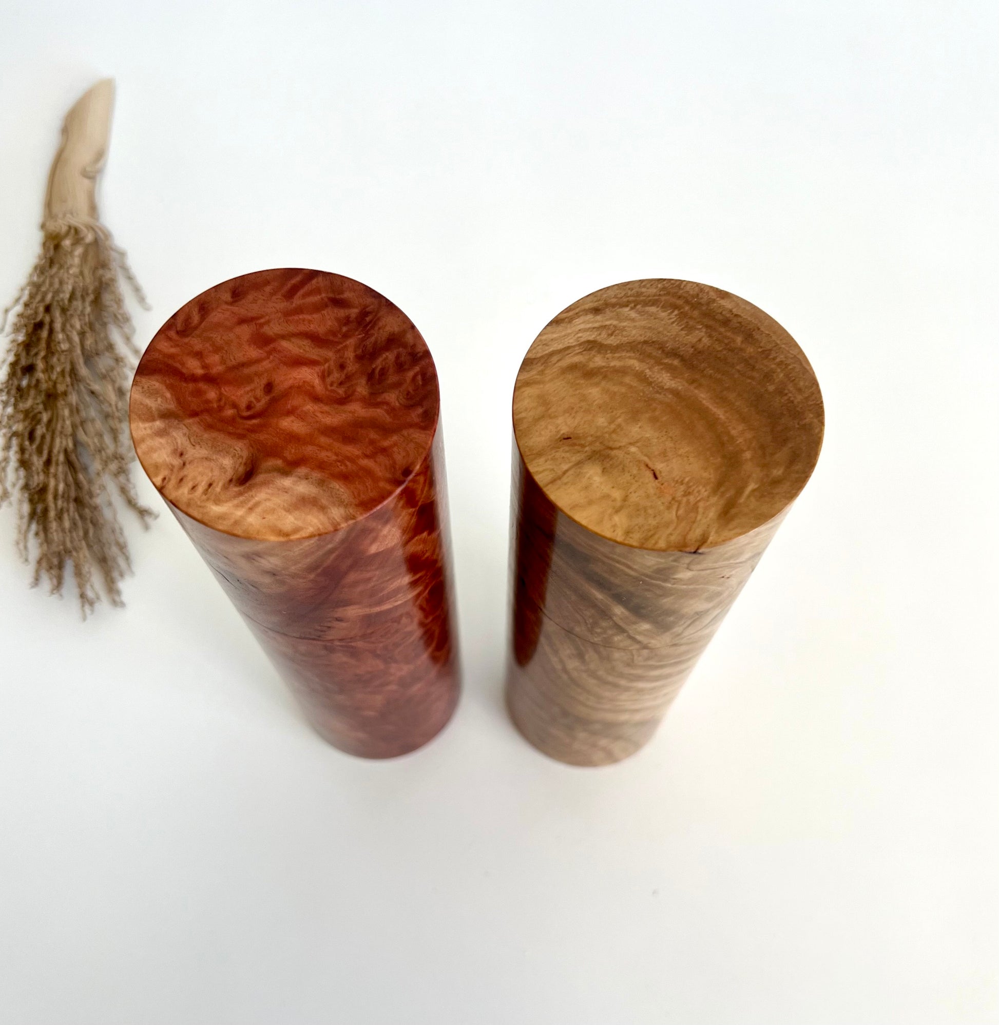 Wooden cylindrical shape salt and pepper grinders made from Australian Bimble box burl and Red Mallee burl timbers