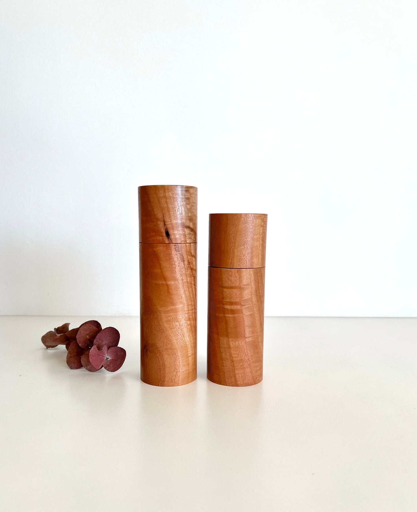 Wooden cylindrical shape salt and pepper grinders made from Australian River red gum timber