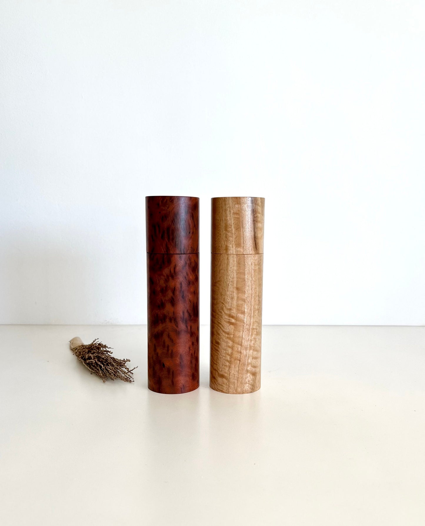 Wooden cylindrical shape salt and pepper grinders made from Australian Paperbark and Manna gum timbers