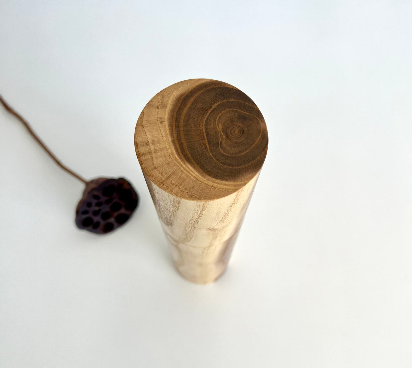 Birdseye view of wooden cylindrical shape salt and pepper grinder made from Australian Mulberry timber.