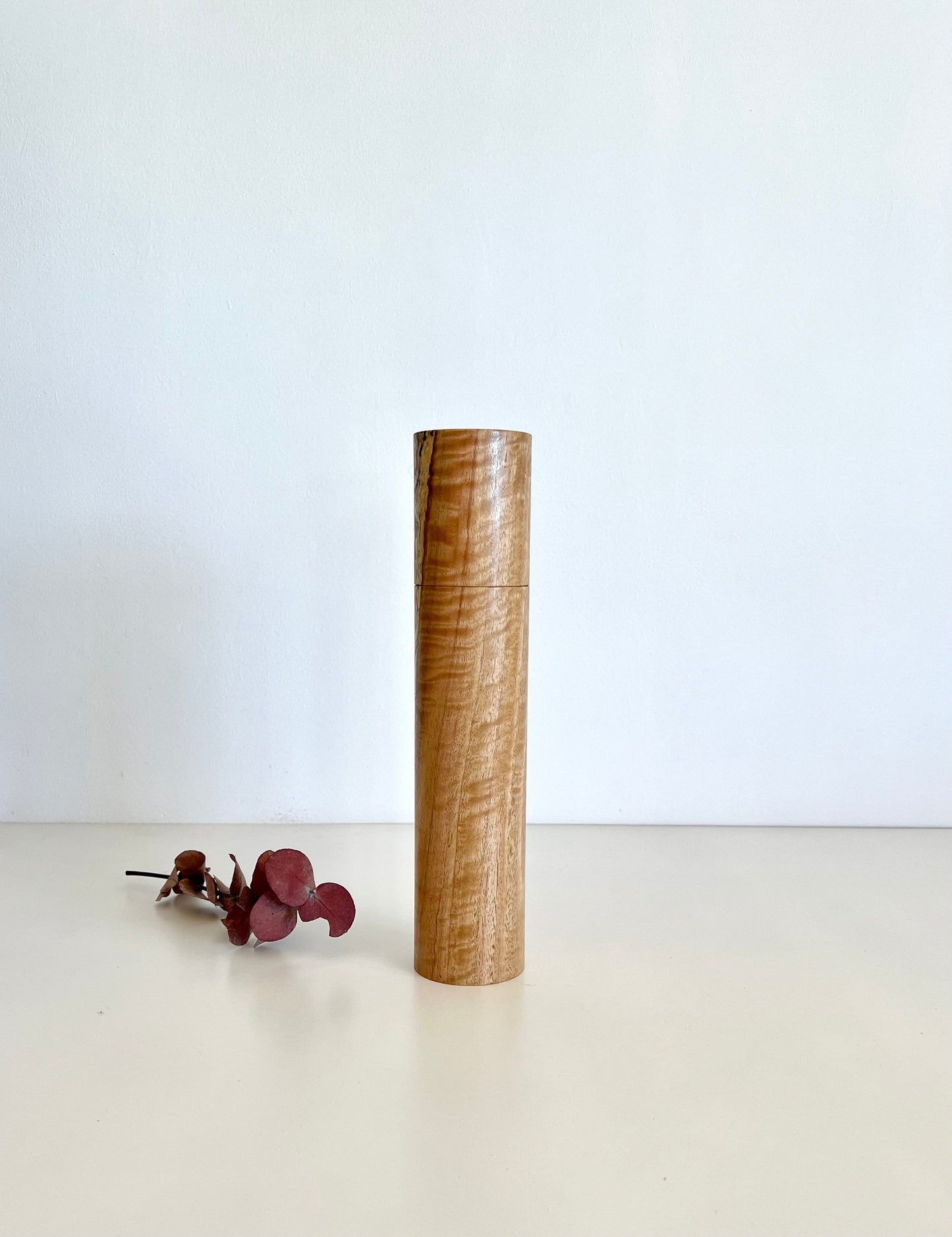 Wooden cylindrical shape salt and pepper grinder made from Australian Manna gum timber