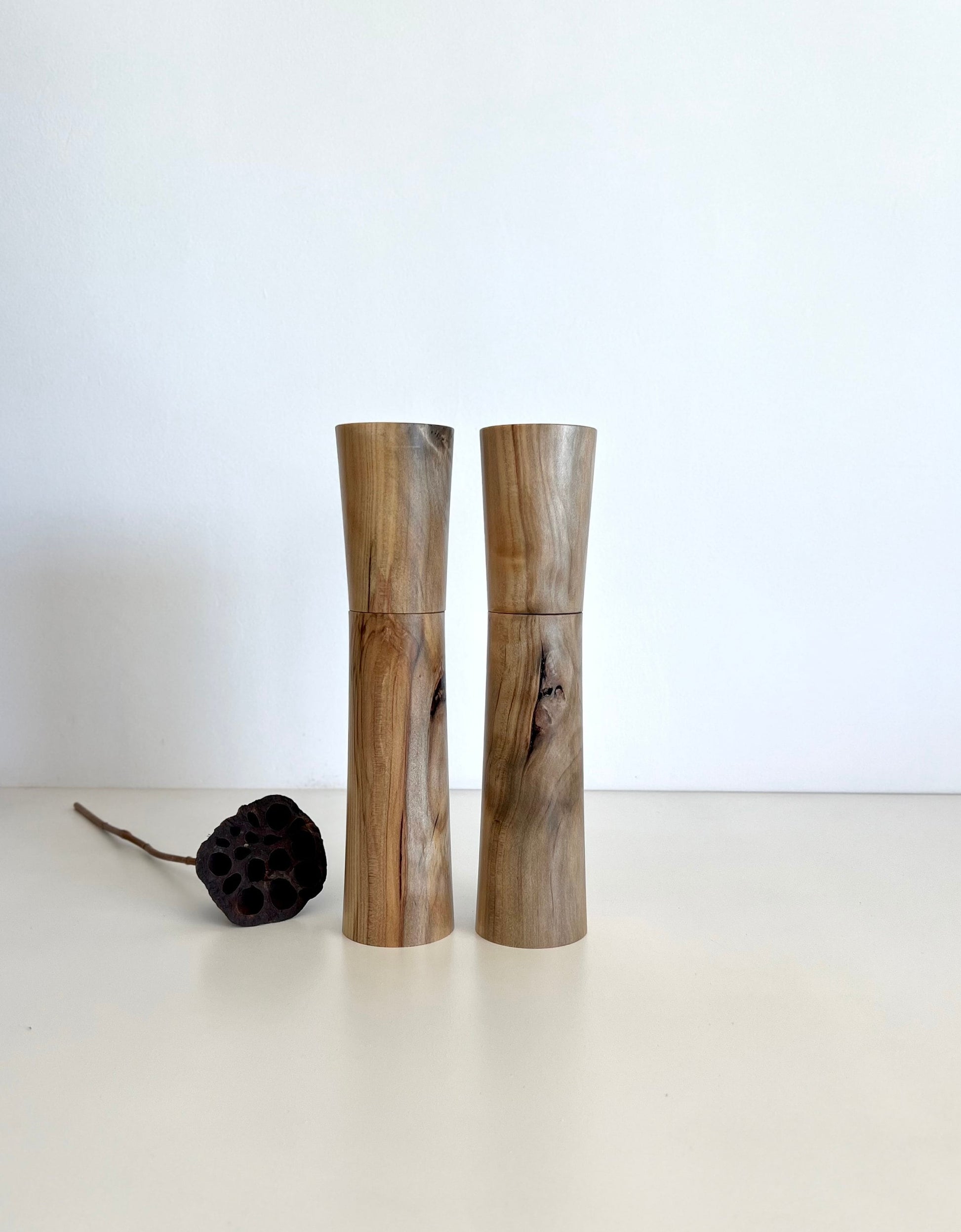 Wooden cylindrical shape salt and pepper grinders made from Australian Norfolk Island Pine timber