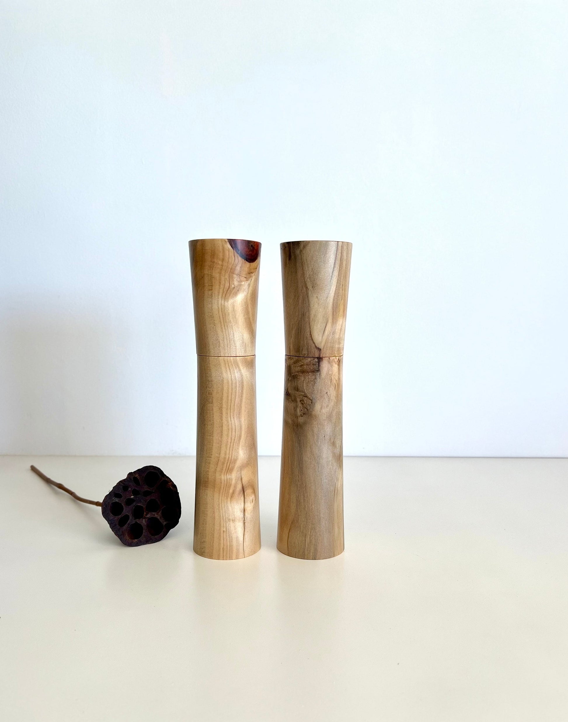 Wooden cylindrical shape salt and pepper grinders made from Australian Norfolk Island Pine timber