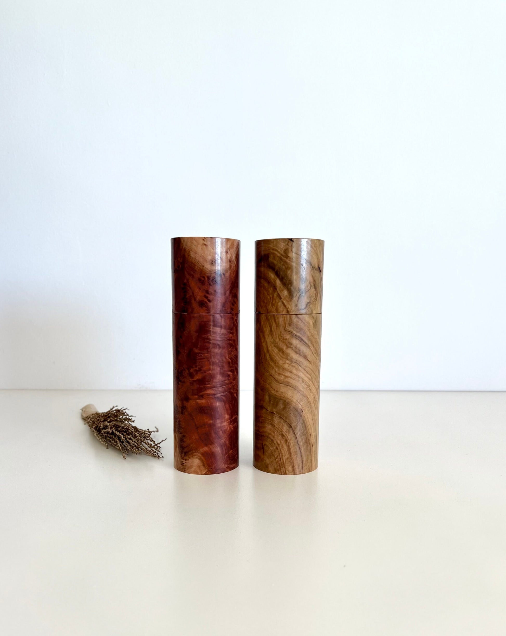 Wooden cylindrical shape salt and pepper grinders made from Australian Bimble box burl and Red Mallee burl timbers