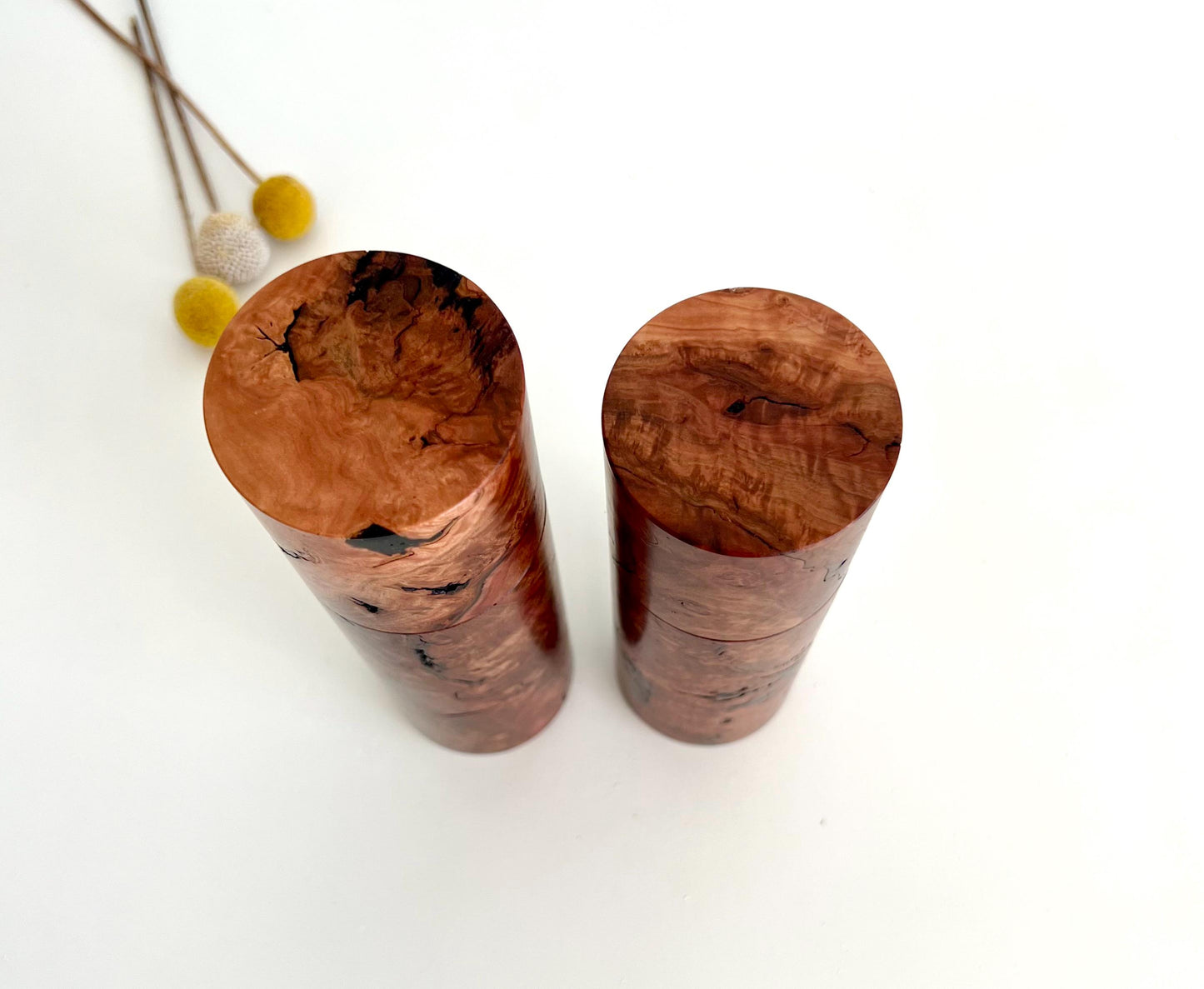 Birdseye view of wooden cylindrical shape salt and pepper grinders made from Australian Gimlet Burl timber