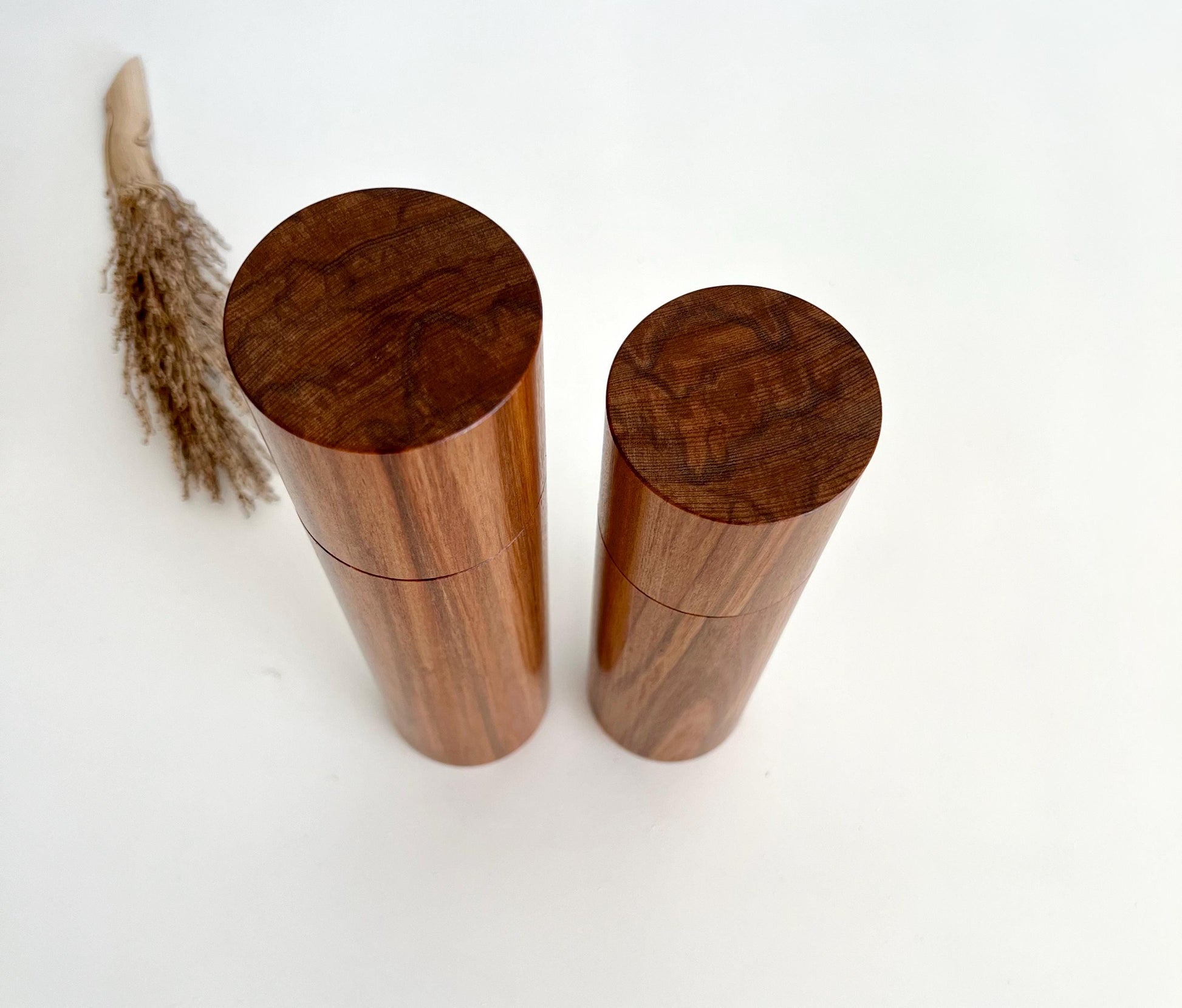 Birdseye view of wooden cylindrical shape salt and pepper grinders made from Australian Tea Tree timber