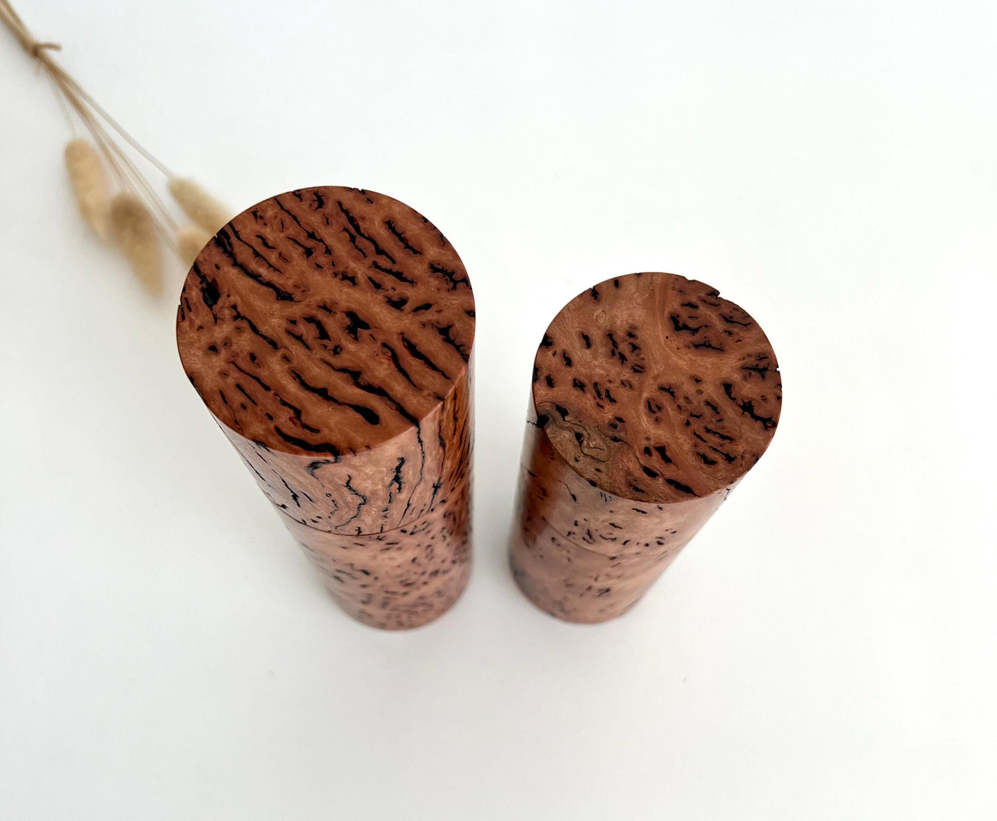 Birdseye view of wooden cylindrical shape salt and pepper grinders made from Australian Wandoo burl timber