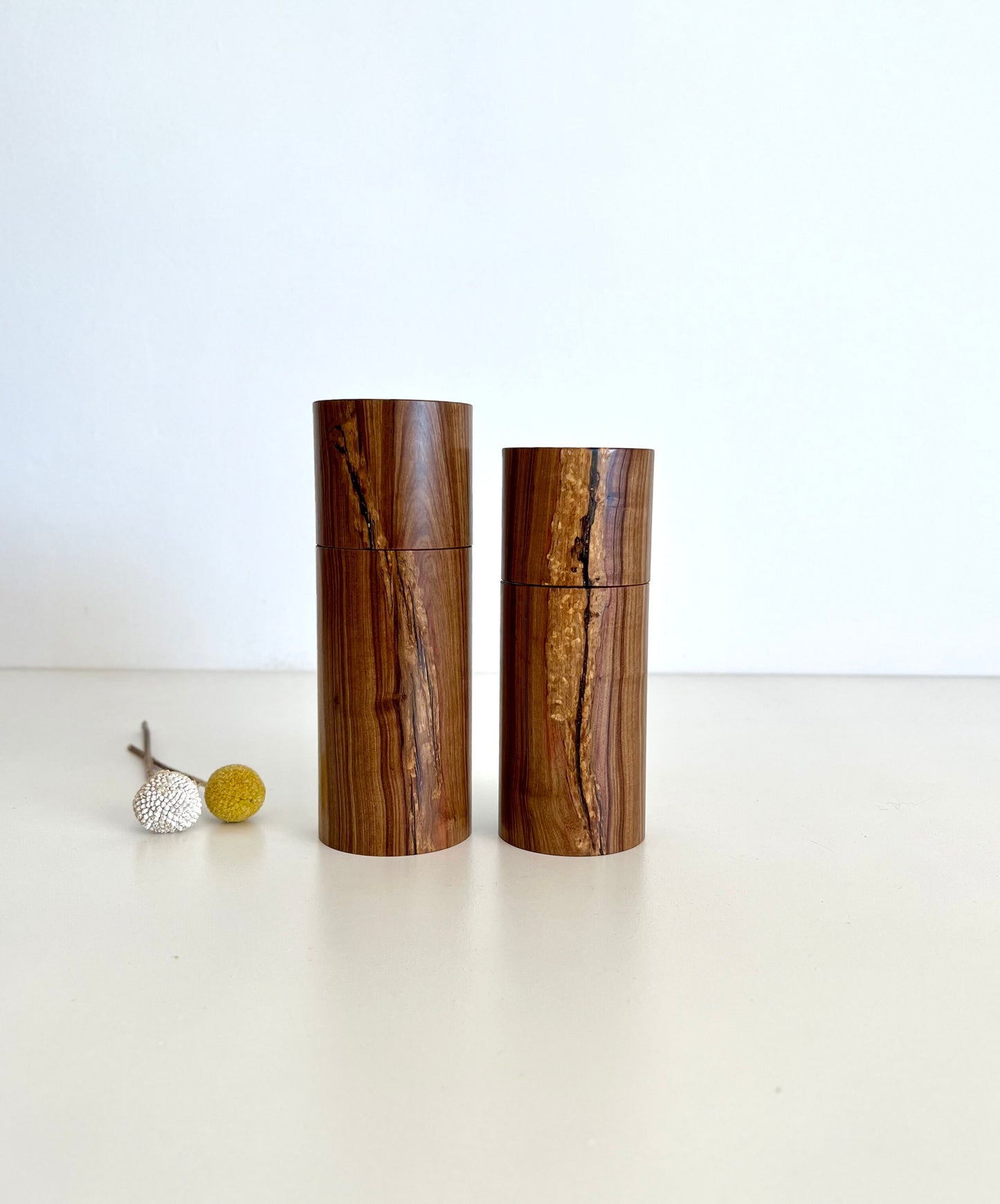 Wooden cylindrical shape salt and pepper grinders made from Australian Buddha timber