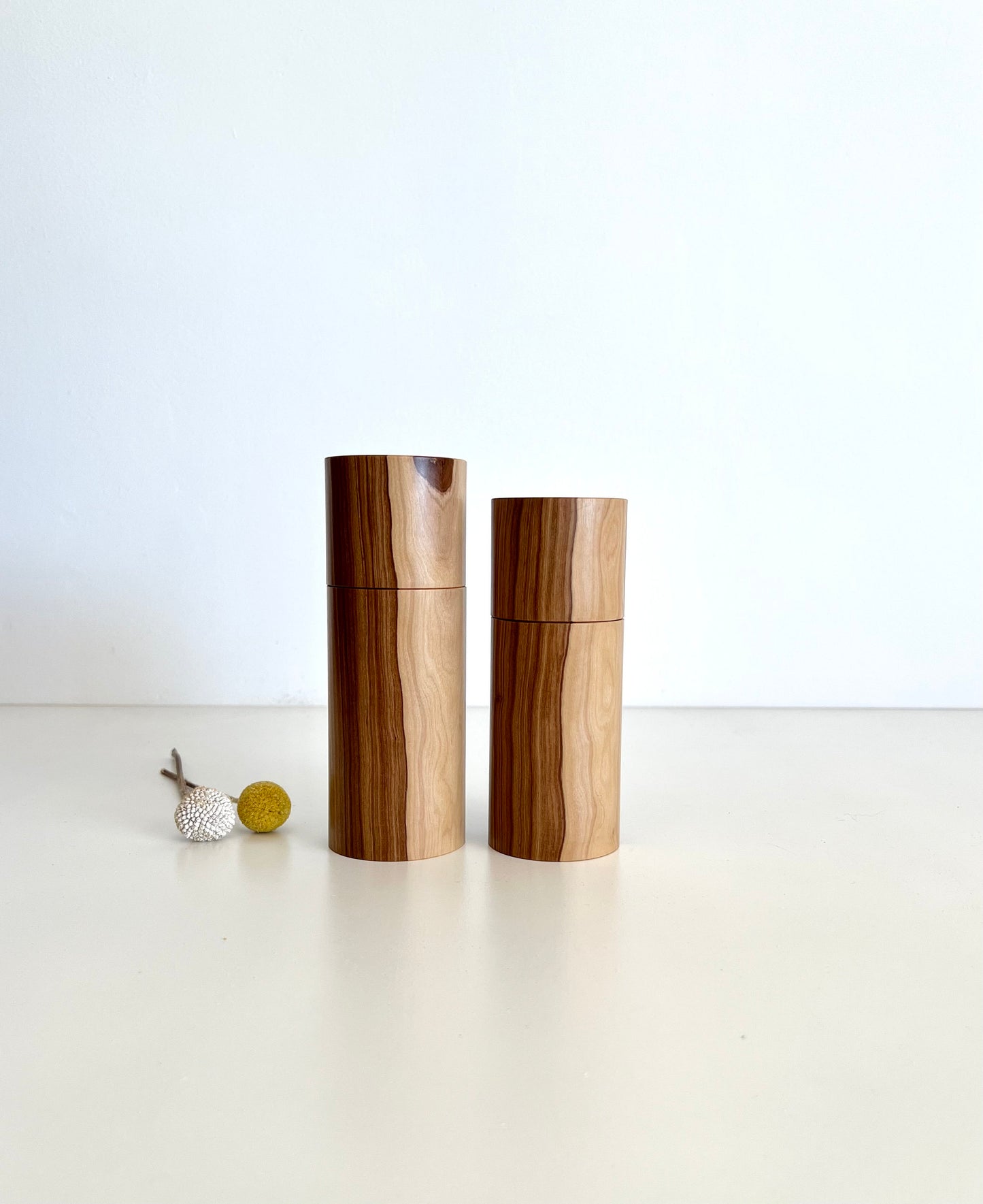 Wooden cylindrical shape salt and pepper grinders made from Australian Buddha timber