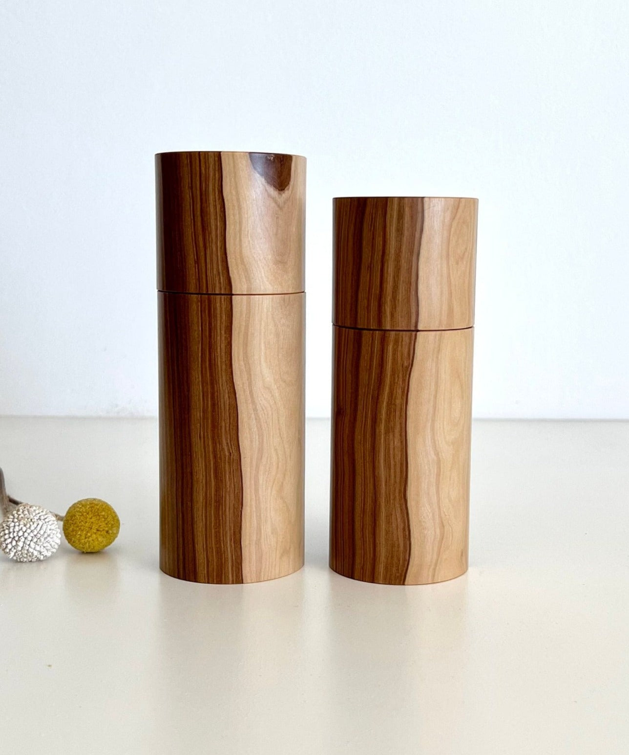 Wooden cylindrical shape salt and pepper grinders made from Australian Buddha timber