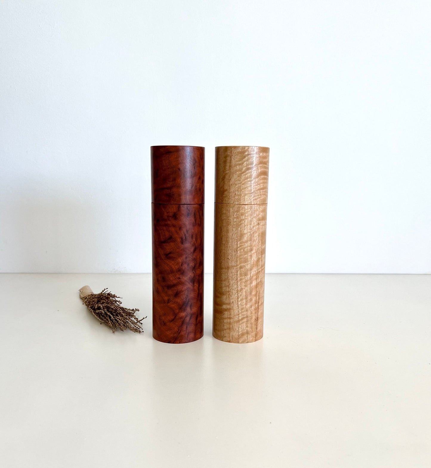 Wooden cylindrical shape salt and pepper grinders made from Australian Paperbark and Manna gum timbers