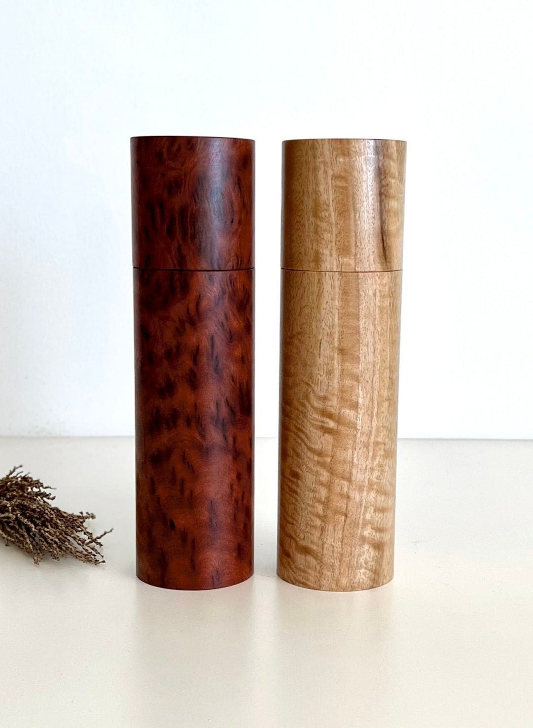 Wooden cylindrical shape salt and pepper grinders made from Australian Paperbark and Manna gum timbers