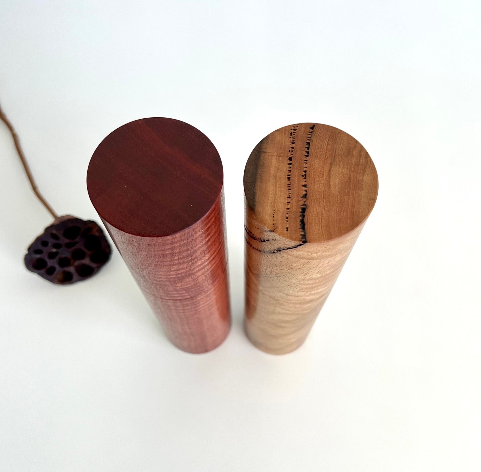 Birdseye view of wooden cylindrical shape salt and pepper grinders made from Australian Jarrah and Marri timbers