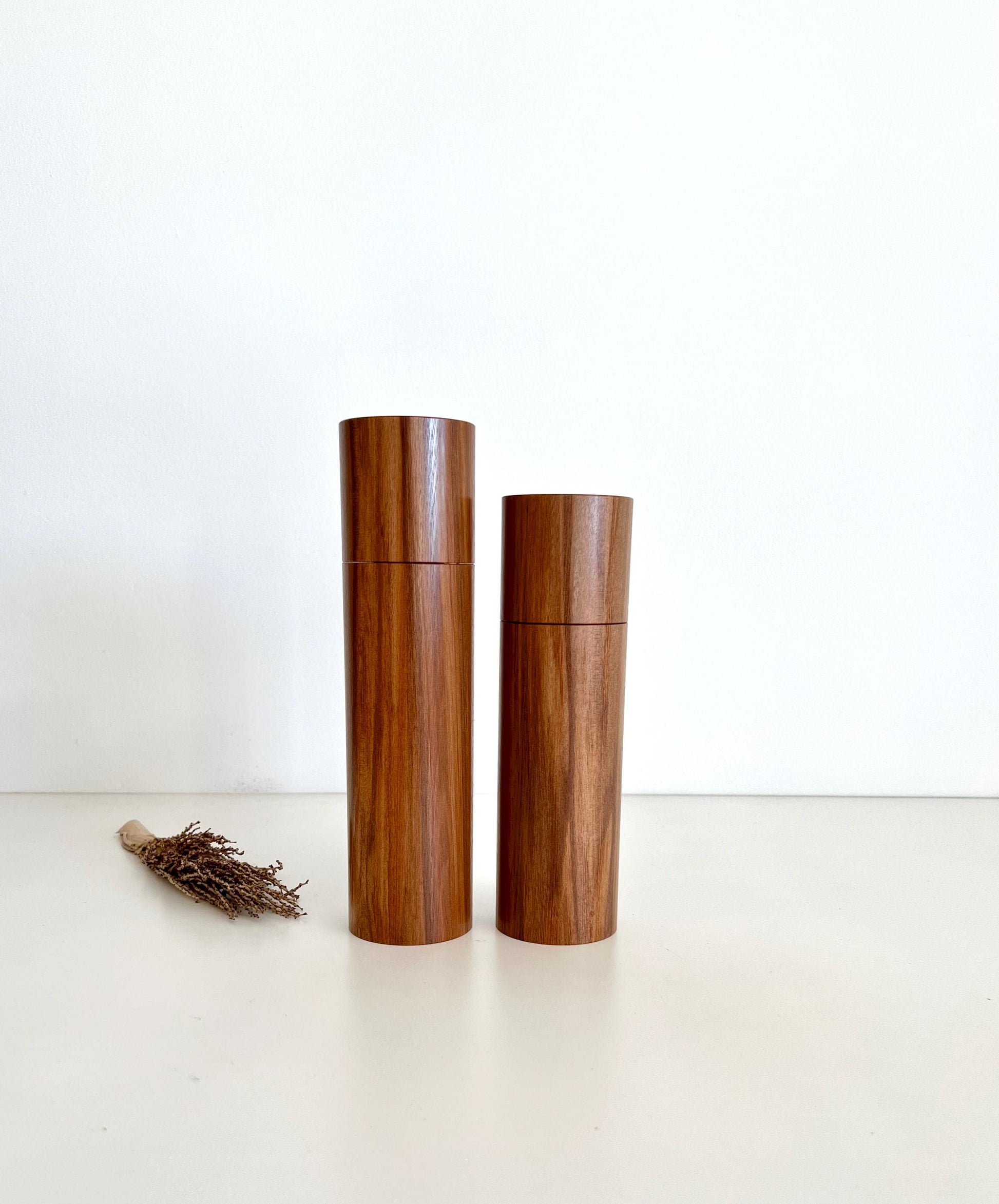 Wooden cylindrical shape salt and pepper grinders made from Australian Tea Tree timber.