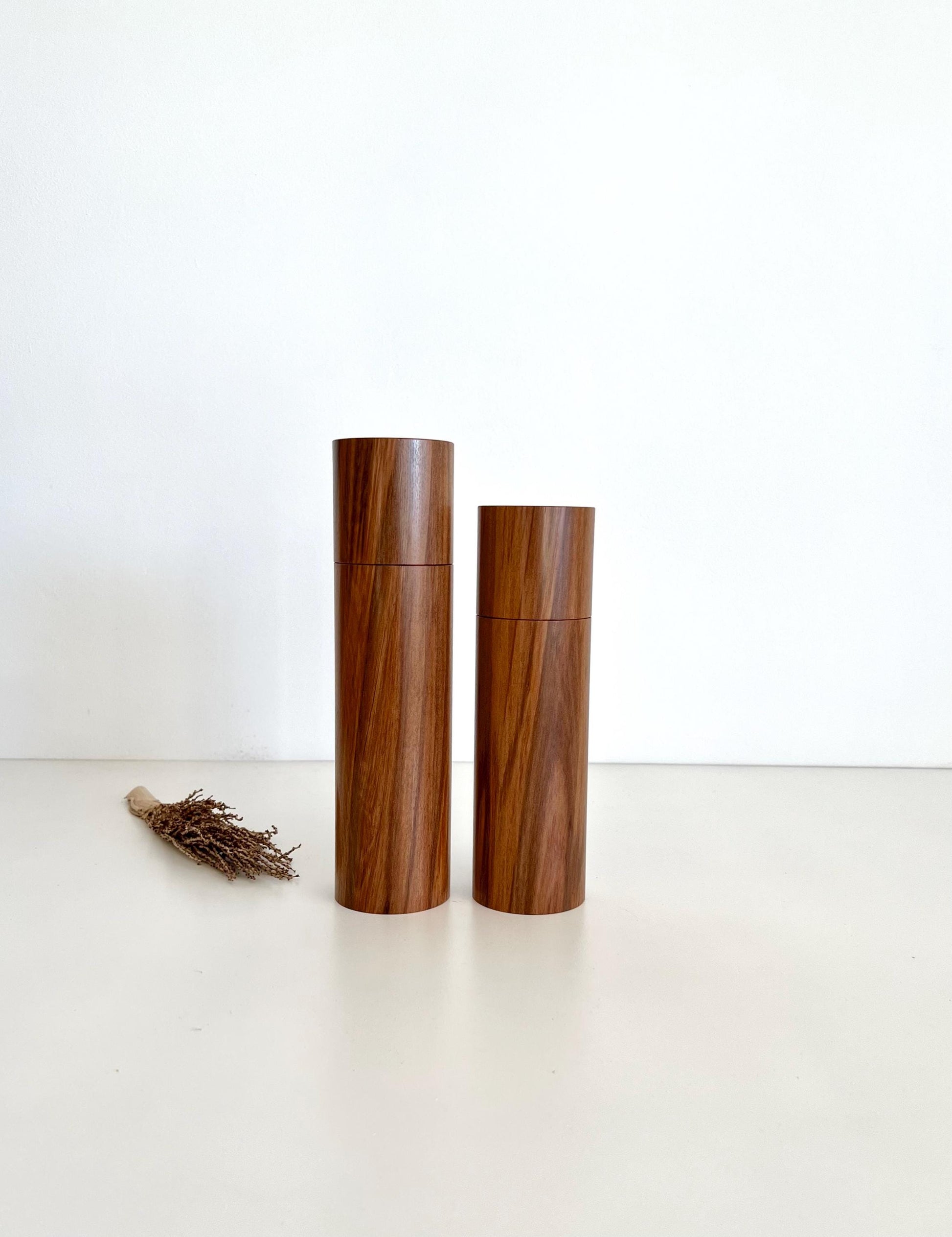 Wooden cylindrical shape salt and pepper grinders made from Australian Tea Tree timber.