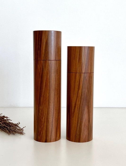 Wooden cylindrical shape salt and pepper grinders made from Australian Tea Tree timber.