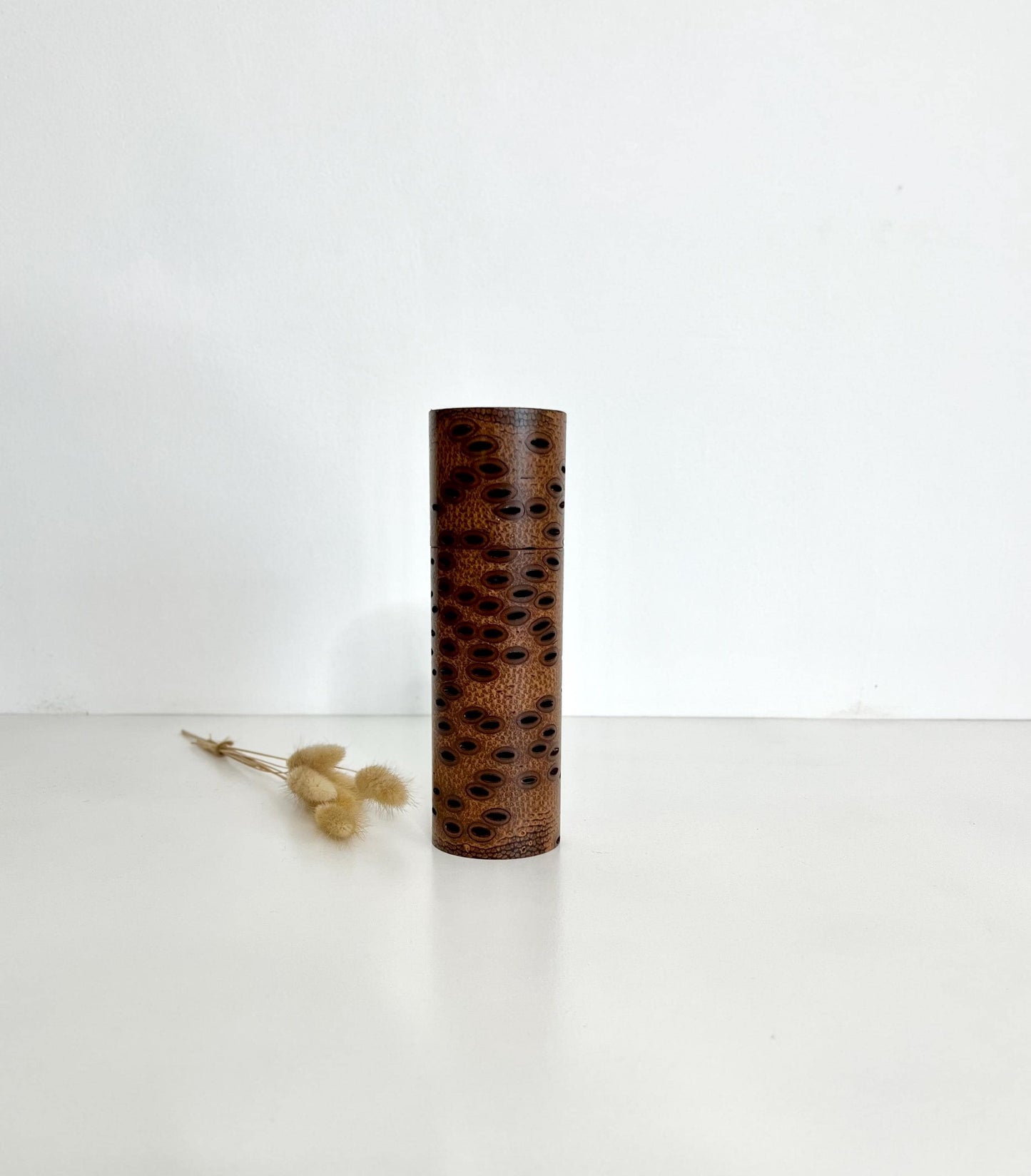 Wooden cylindrical shape salt and pepper grinder made from Australian Banksia seed Pod wood