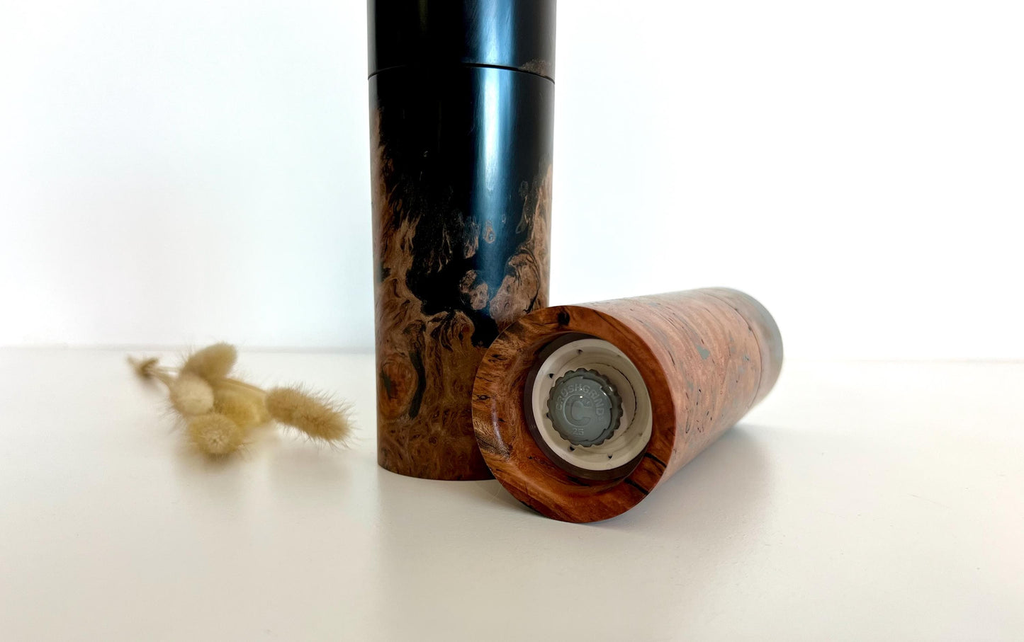 Bottom of salt and pepper grinder showing Crushgrind ceramic grinding mechanism and the adjustment knob