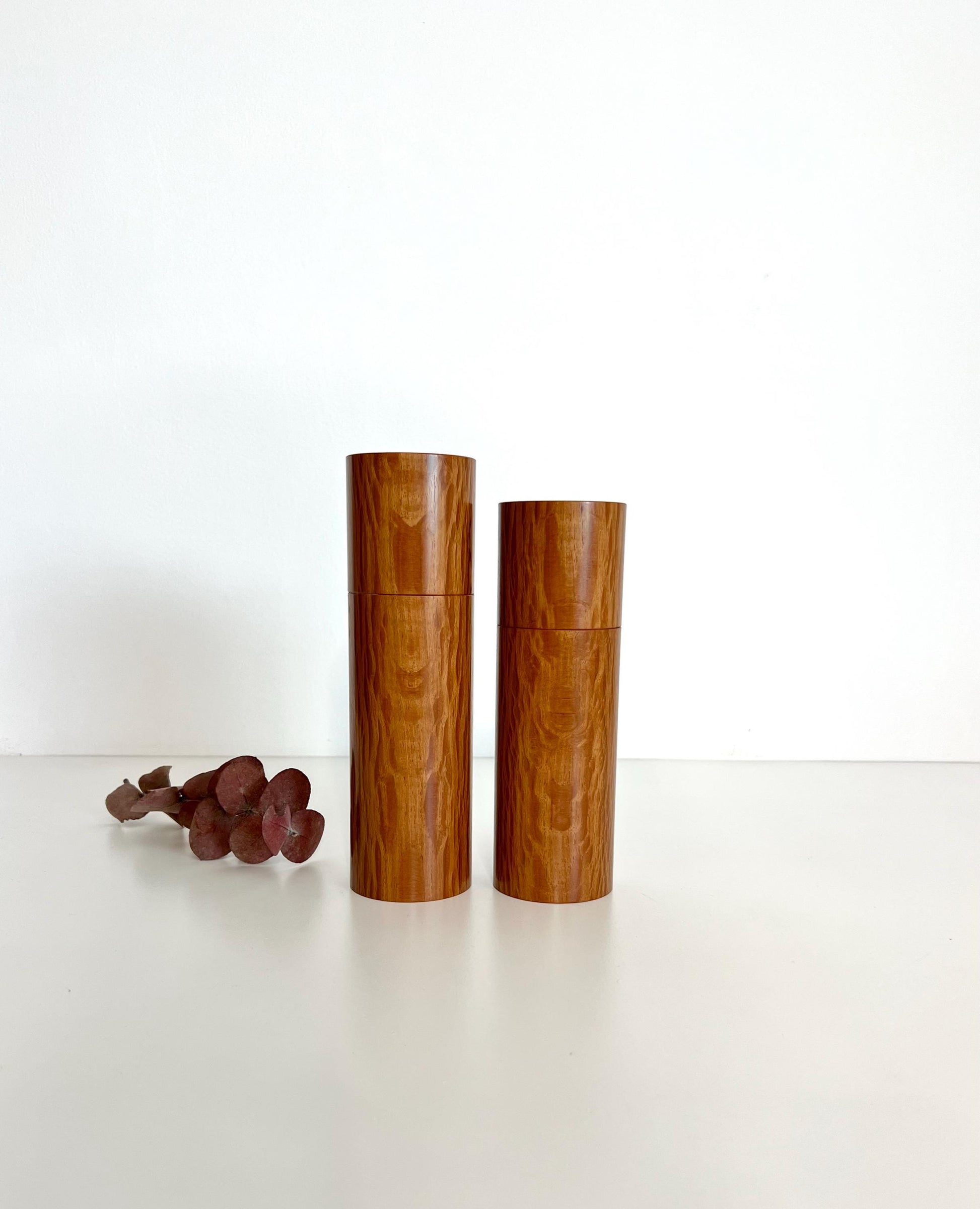 Wooden cylindrical shape salt and pepper grinders made from Sheoak timber