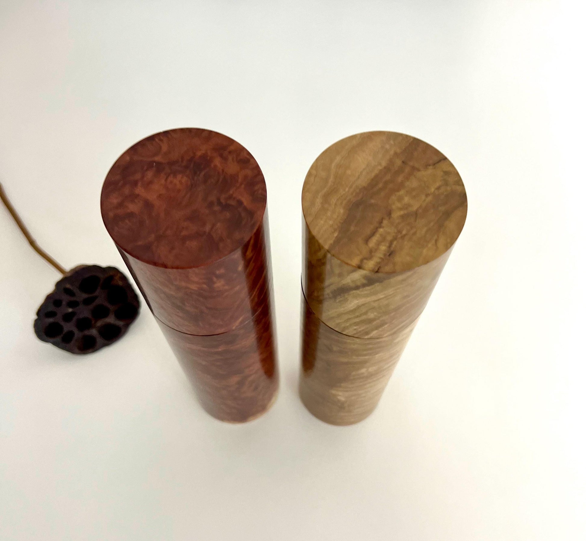 Birdseye view of wooden cylindrical shape salt and pepper grinders made from Australian Red Mallee Burl and Bimble Box Burl timbers