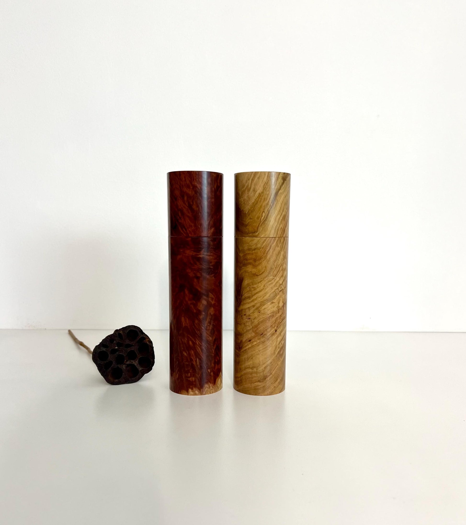 Wooden cylindrical shape salt and pepper grinders made from Red Mallee Burl and Bimble Box Burl timbers