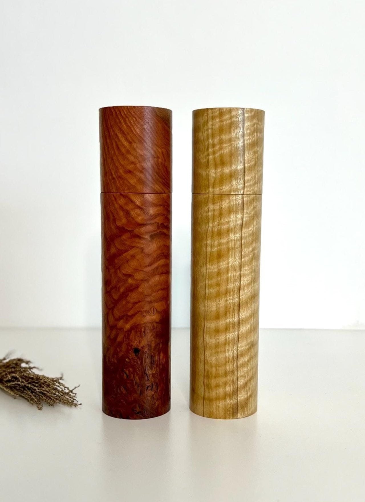 Wooden cylindrical shape salt and pepper grinders made from Jarrah and Narrow leaf Peppermint timbers