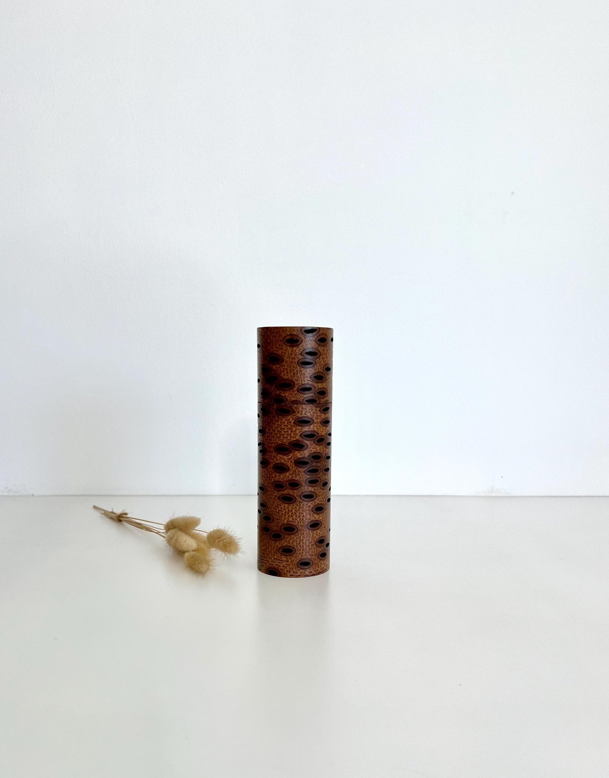 Wooden cylindrical shape salt and pepper grinder made from Australian Banksia seed Pod wood