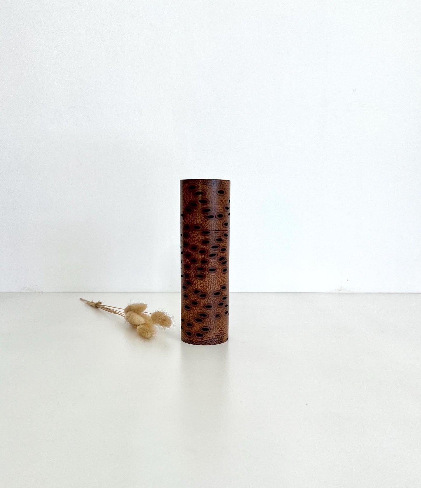 Wooden cylindrical shape salt and pepper grinder made from Australian Banksia seed Pod wood