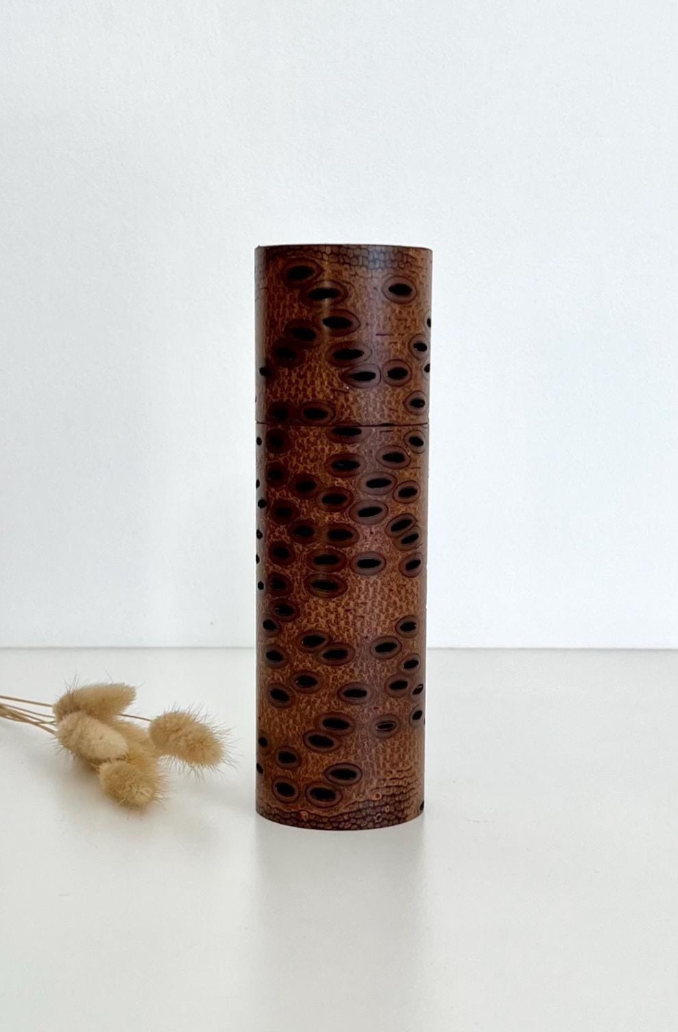 Wooden cylindrical shape salt and pepper grinder made from Australian Banksia seed Pod wood