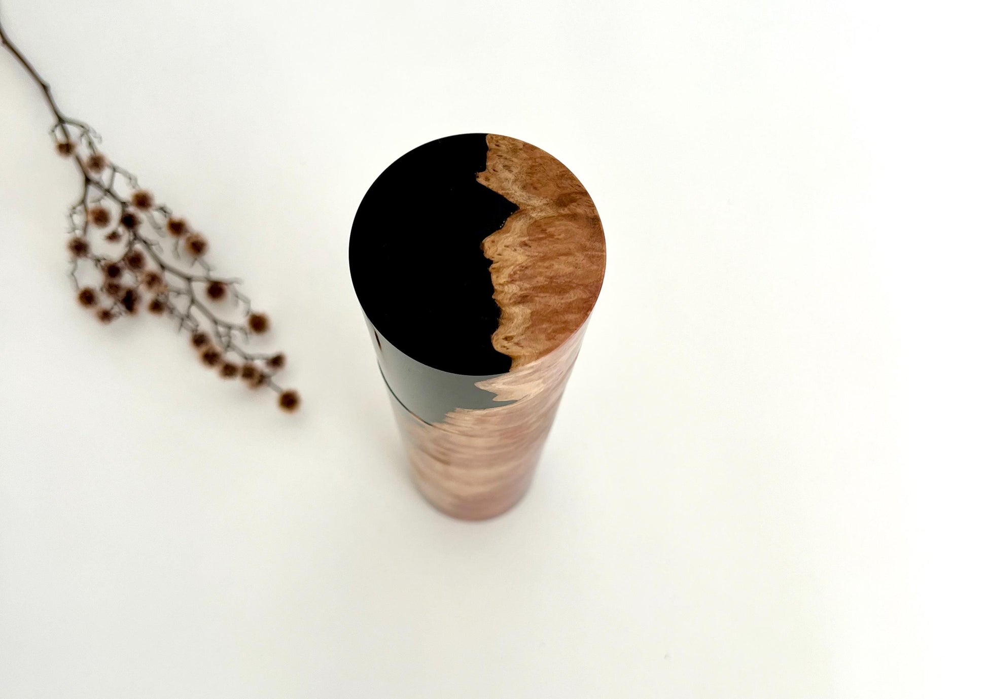 Birdseye view of wooden cylindrical shape salt and pepper grinder made from Red Mallee burl and Epoxy resin timber.