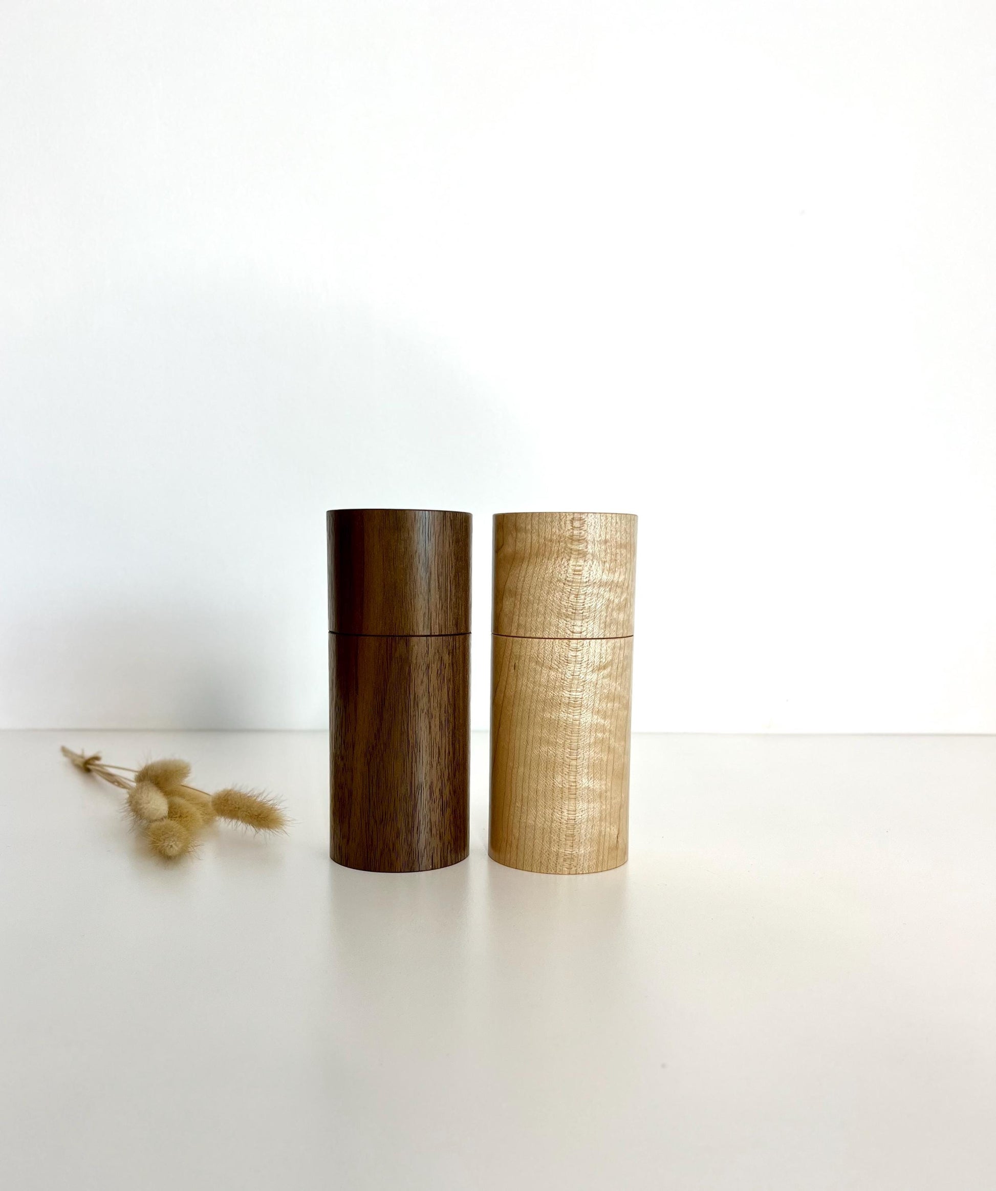 Wooden cylindrical shape salt and pepper grinders made from Maple and Black Walnut timbers