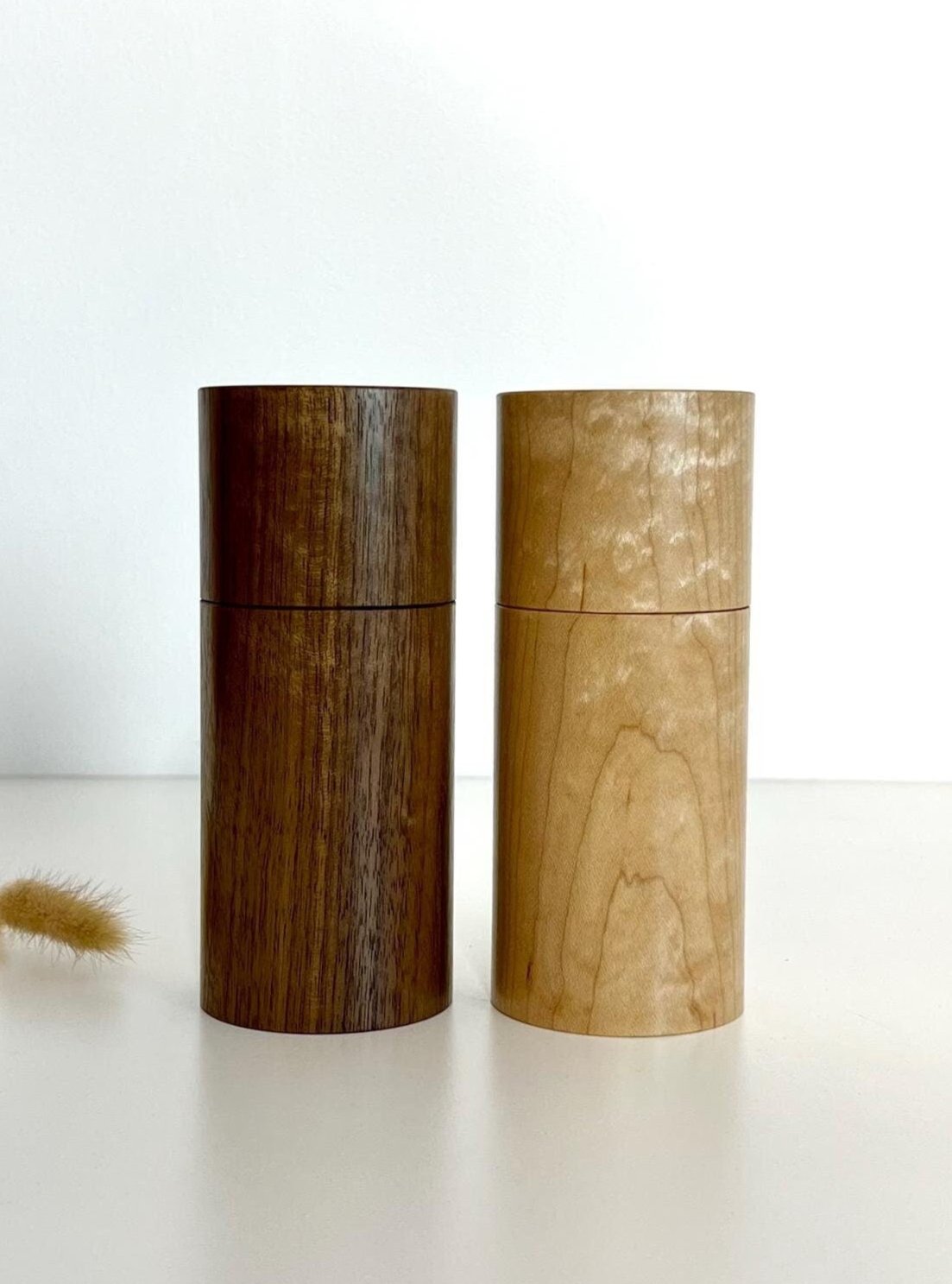 Wooden cylindrical shape salt and pepper grinders made from Maple and Black Walnut timbers