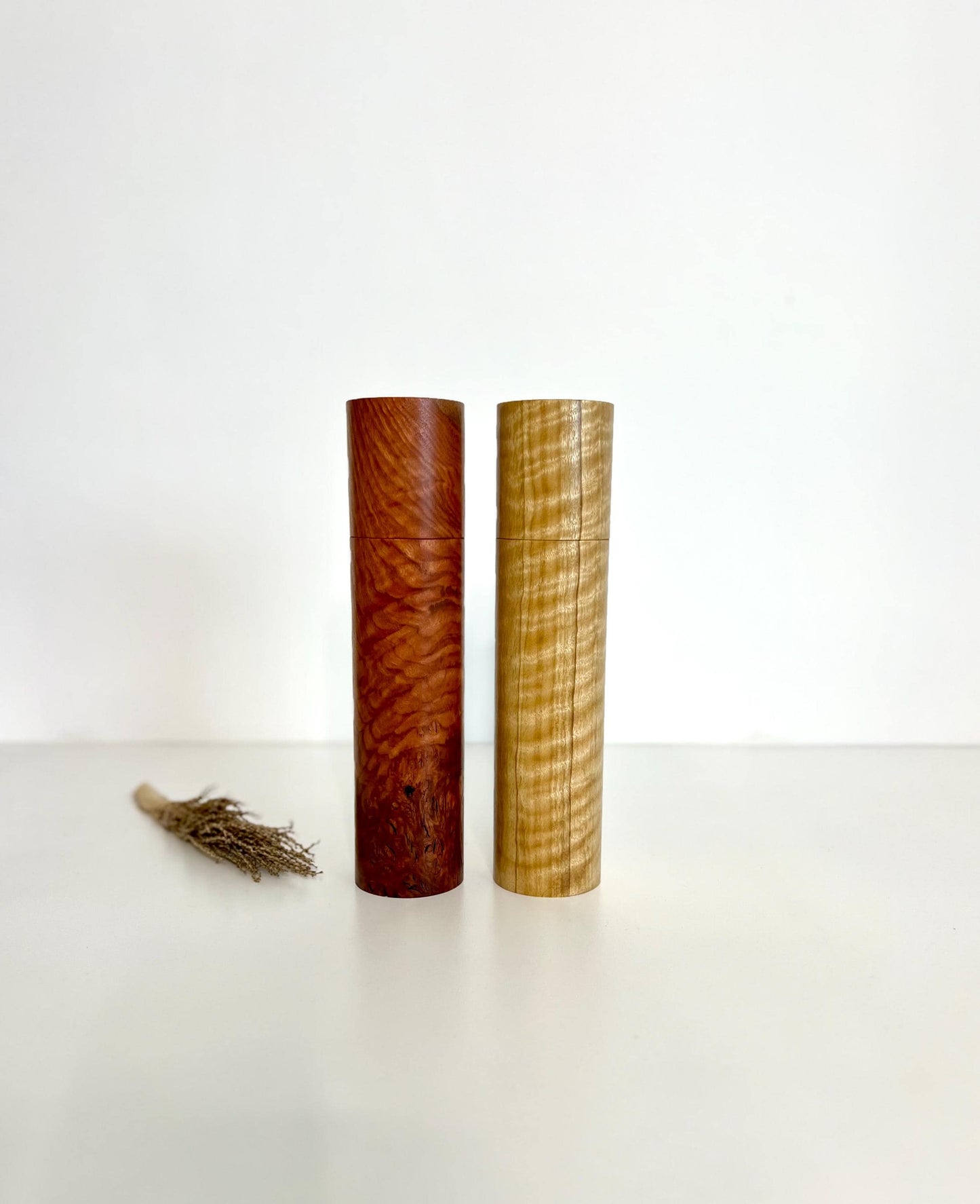 Wooden cylindrical shape salt and pepper grinders made from Jarrah and Narrow leaf Peppermint timbers