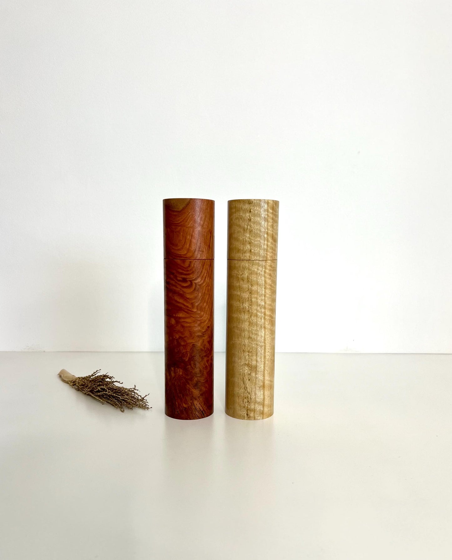 Wooden cylindrical shape salt and pepper grinders made from Jarrah and Narrow leaf Peppermint timbers